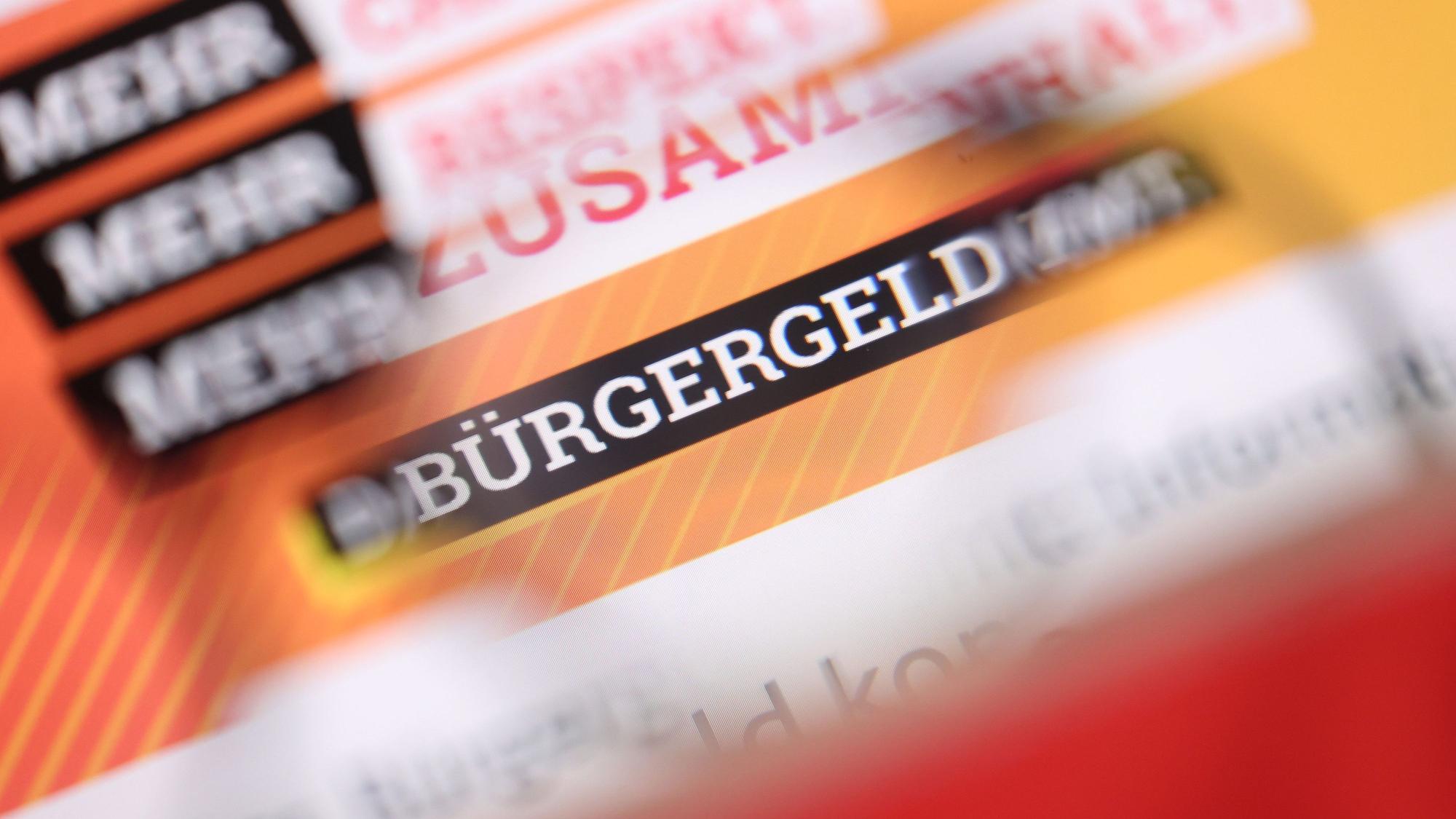 „Bürgergeld“ ist auf der Homepage des Bundesministeriums für Arbeit und Soziales durch eine Brille zu lesen.