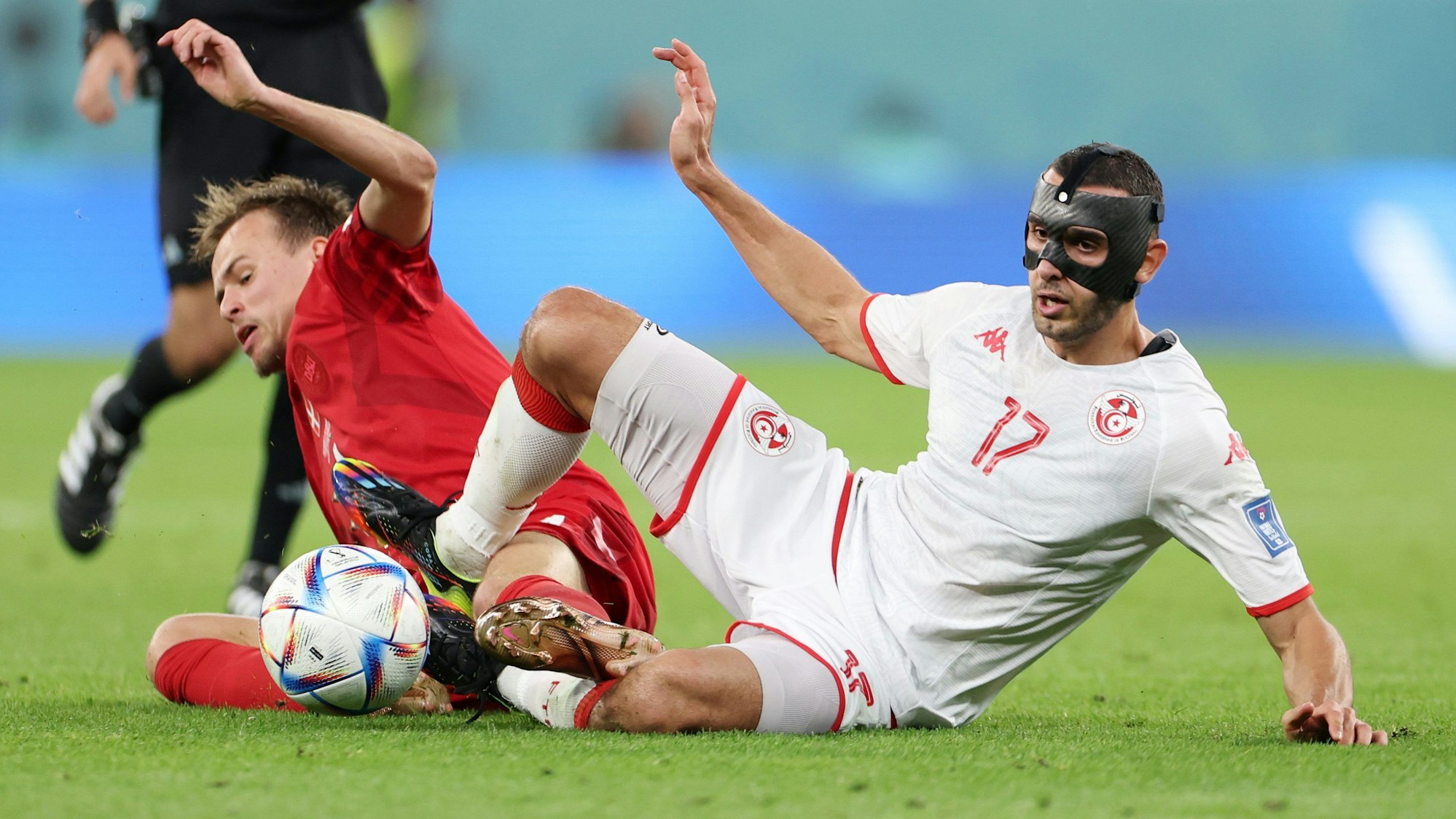 AL RAYYAN, QATAR - NOVEMBER 22: Ellyes Skhiri of Tunisia battles for possession with Mikkel Damsgaard of Denmark during the FIFA World Cup Qatar 2022 Group D match between Denmark and Tunisia at Education City Stadium on November 22, 2022 in Al Rayyan, Qatar. (Photo by Francois Nel/Getty Images)