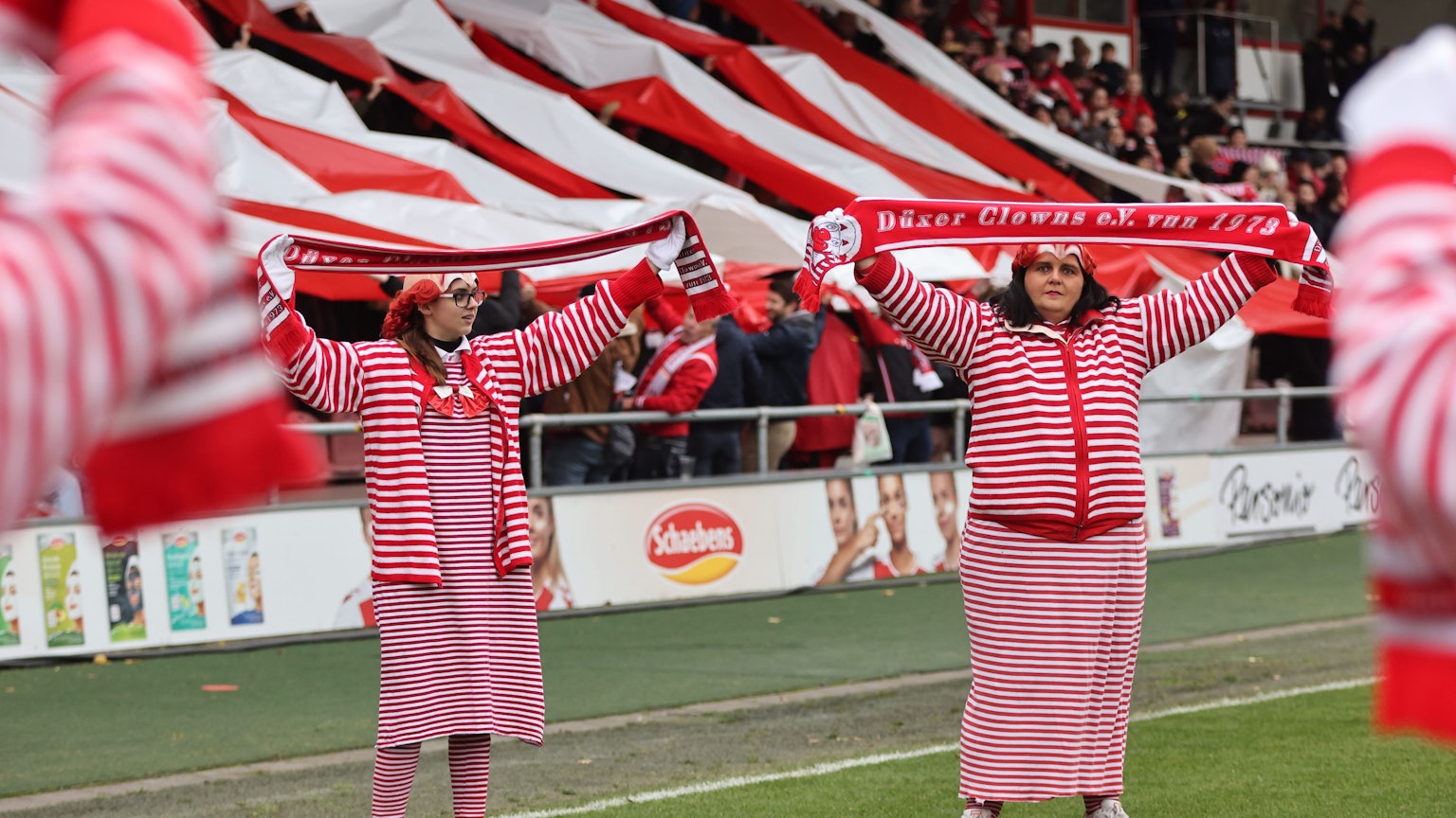 COLOGNE, GERMANY - NOVEMBER 27: Fans of Koeln in carnival costums during the FLYERALRM Frauen-Bundesliga match between 1. FC Koeln and VfL Wolfsburg at Franz-Kremer-Stadion on November 27, 2022 in Cologne, Germany. (Photo by Christof Koepsel/Getty Images for DFB)