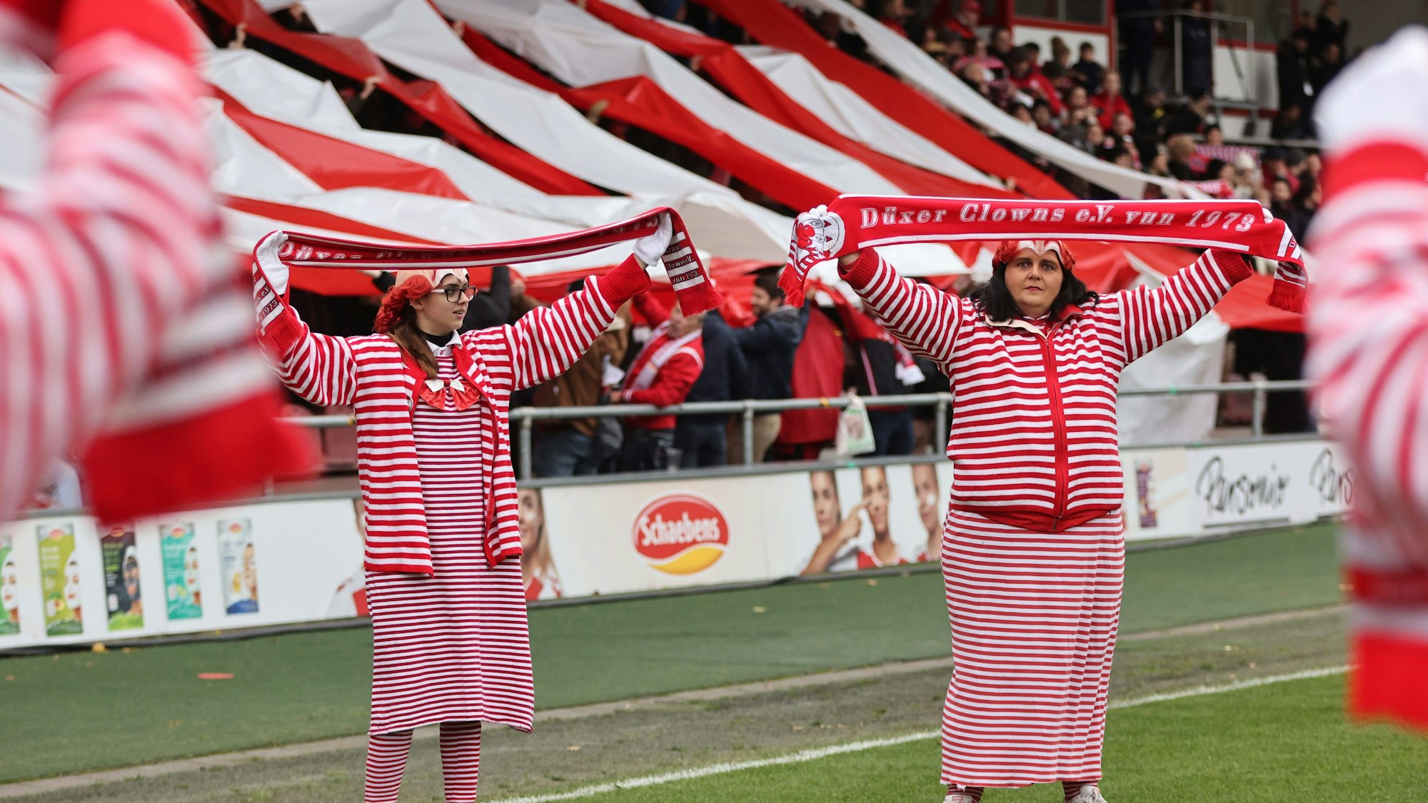 COLOGNE, GERMANY - NOVEMBER 27: Fans of Koeln in carnival costums during the FLYERALRM Frauen-Bundesliga match between 1. FC Koeln and VfL Wolfsburg at Franz-Kremer-Stadion on November 27, 2022 in Cologne, Germany. (Photo by Christof Koepsel/Getty Images for DFB)