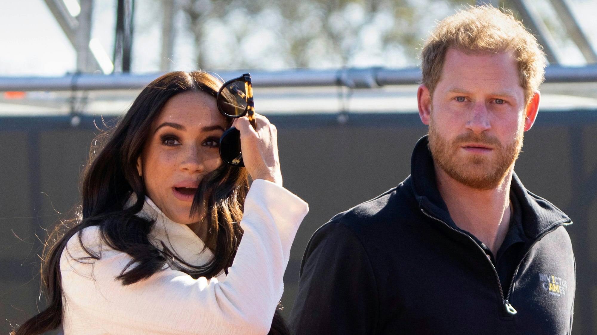 FILE - Prince Harry and Meghan Markle, Duke and Duchess of Sussex visit the track and field event at the Invictus Games in The Hague, Netherlands, Sunday, April 17, 2022. Prince Harry and his wife, Meghan, are expected to vent their grievances against the monarchy when Netflix releases the final episodes of a series about the couple’s decision to step away from royal duties and make a new start in America. (AP Photo/Peter Dejong, File)