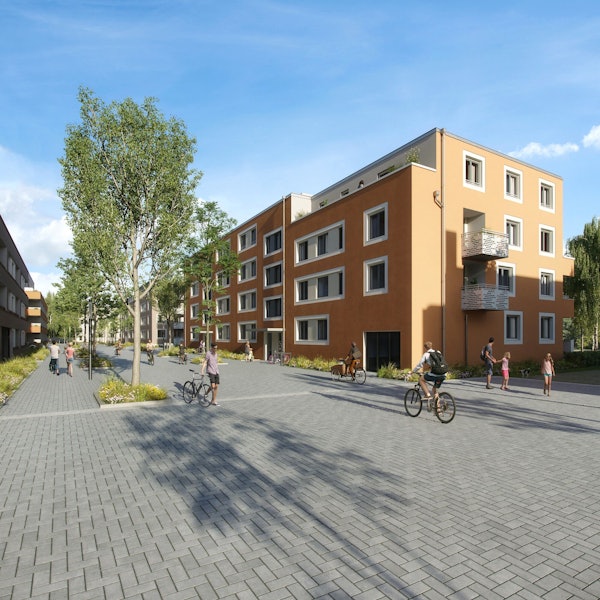 Neue Wohnblöcke und eine Straße mit Fußgängern und Radfahrern sind zu sehen.