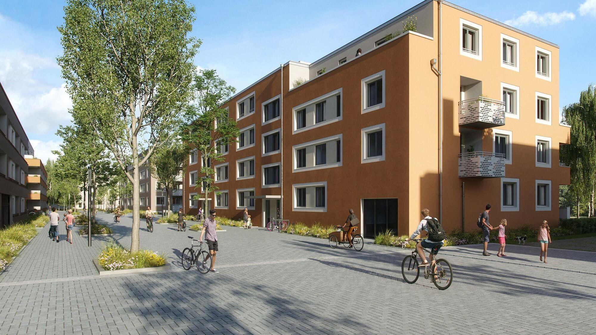 Neue Wohnblöcke und eine Straße mit Fußgängern und Radfahrern sind zu sehen.
