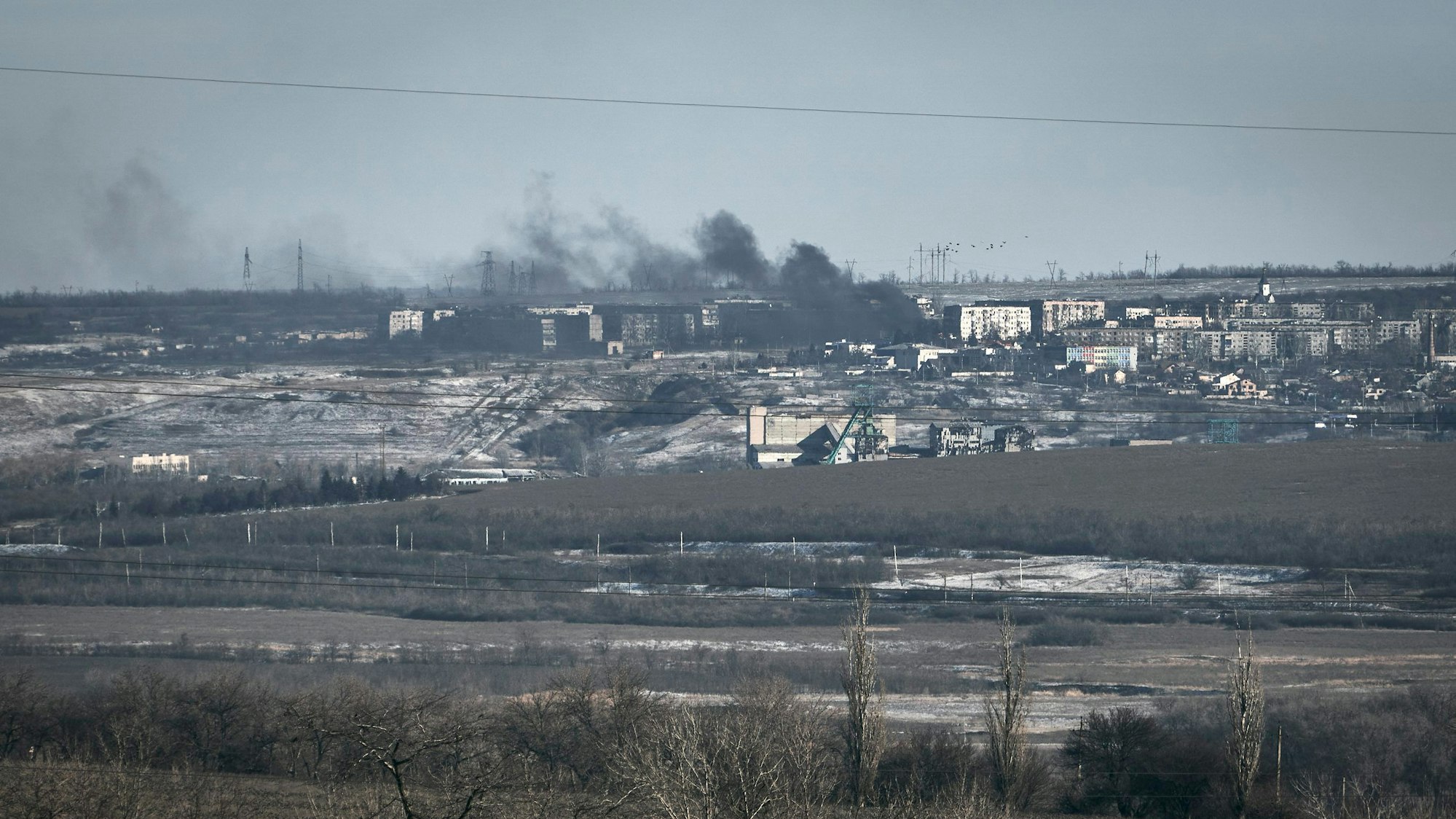 Smoke raises after shelling in Soledar, Donetsk region, Ukraine, Wednesday, Jan. 11, 2023. (AP Photo/Libkos)