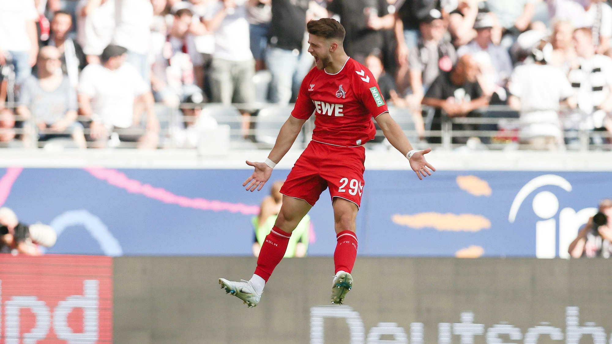 FRANKFURT AM MAIN, GERMANY - AUGUST 21: Jan Thielmann of 1. FC Köln celebrates their team's first goal during the Bundesliga match between Eintracht Frankfurt and 1. FC Köln at Deutsche Bank Park on August 21, 2022 in Frankfurt am Main, Germany. (Photo by Alex Grimm/Getty Images)