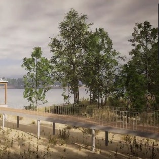 Ein Schiff fährt über den Rhein an einen Anleger.