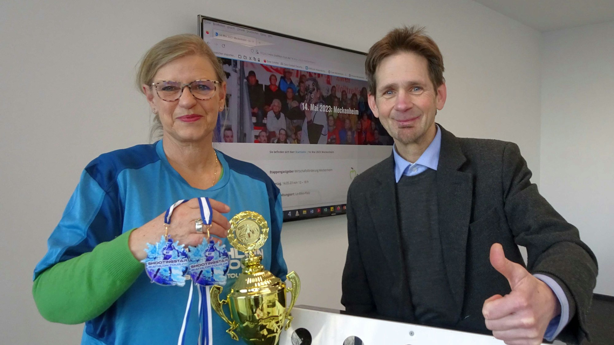 Biathlon-Deutschland Tour macht Station in Meckenheim: Vorstellung der Biathlonarena am Le-Mée-Platz am 14. Mai, dem letzten Tag des Street-Food-Festivals in der Altstadt, durch Meckenheims Citymanagerin Nicole Bangert und Martin Bremer, Inhaber der veranstaltenden inMotion Agentur und Verlag