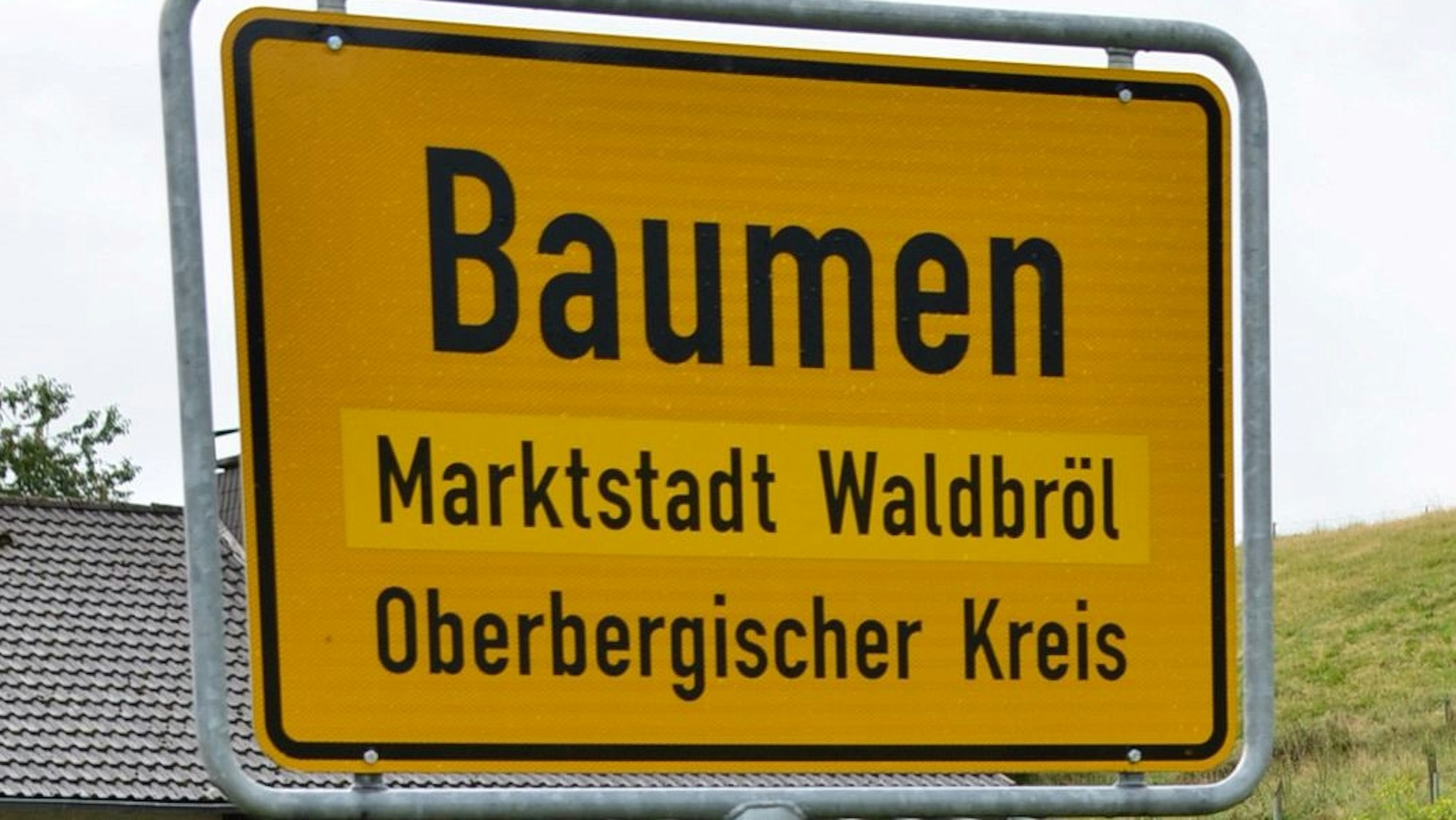 Ortsschild von Baumen