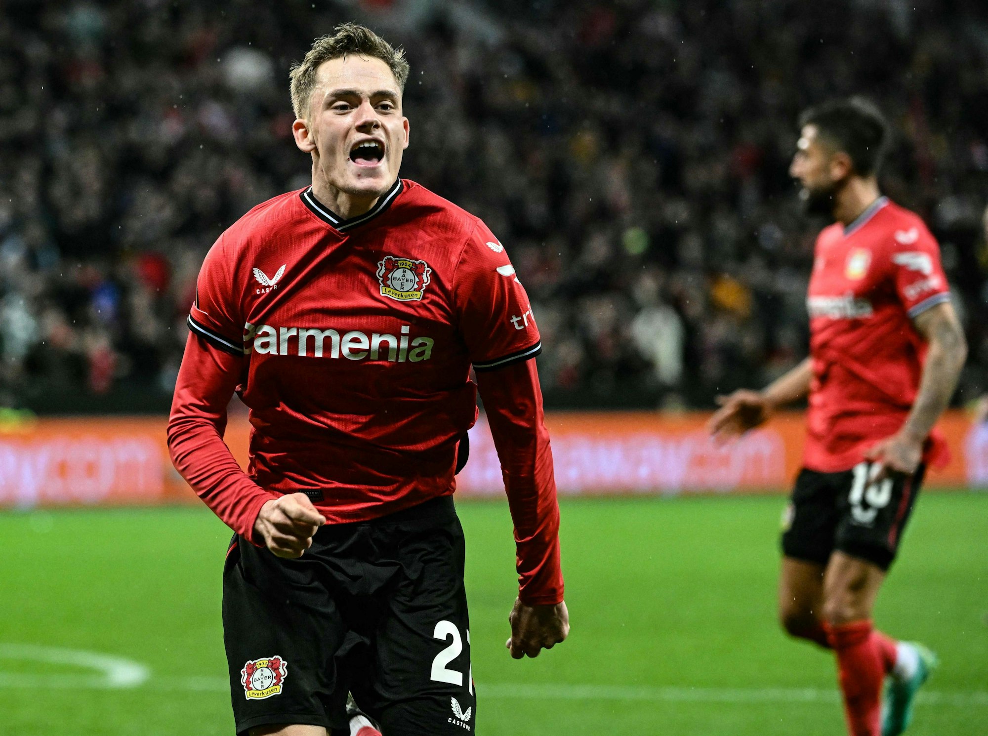 Leverkusen's German forward Florian Wirtz celebrates scoring during the UEFA Europa League Group Quarter final First Leg football match between Bayer Leverkusen and Union St-Gilloise in Leverkusen