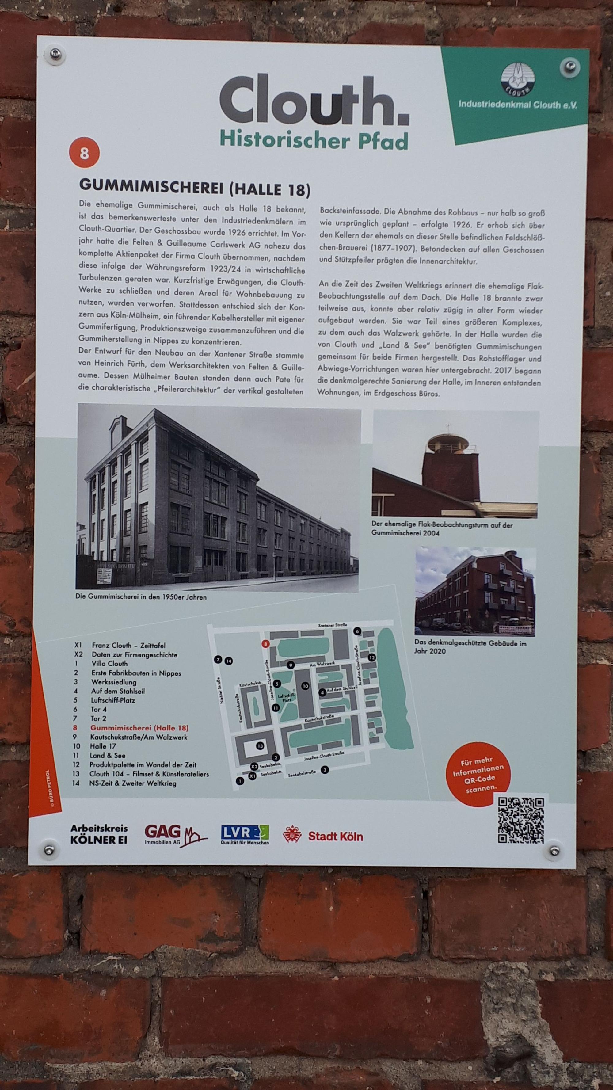 Die Tafel 18 des neuen Geschichtspfad hängt an der Halle 18.