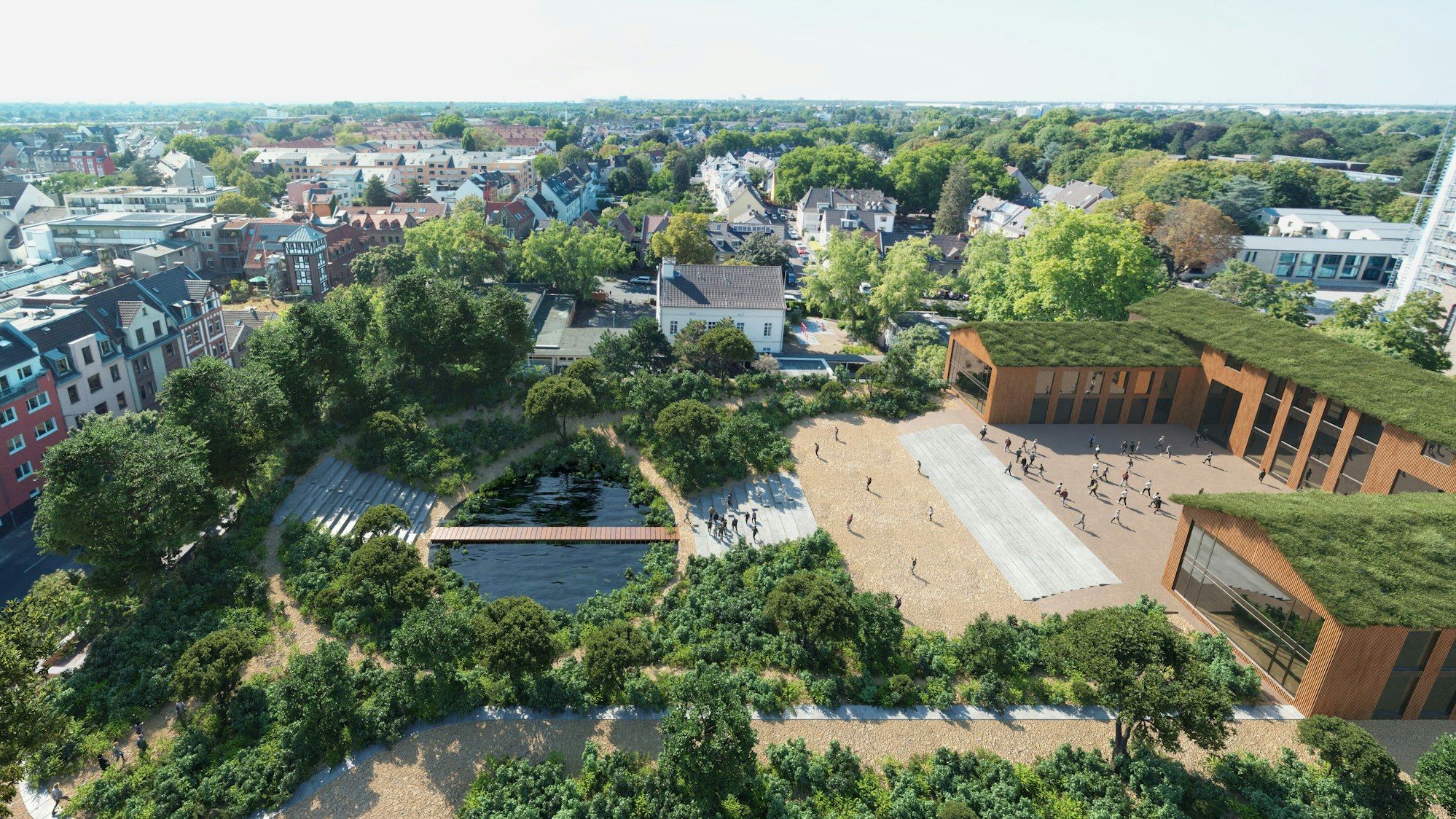 Ein Bild aus der Vogelperspektive zeigt ein Schulgebäude und ein Überlaufbecken.