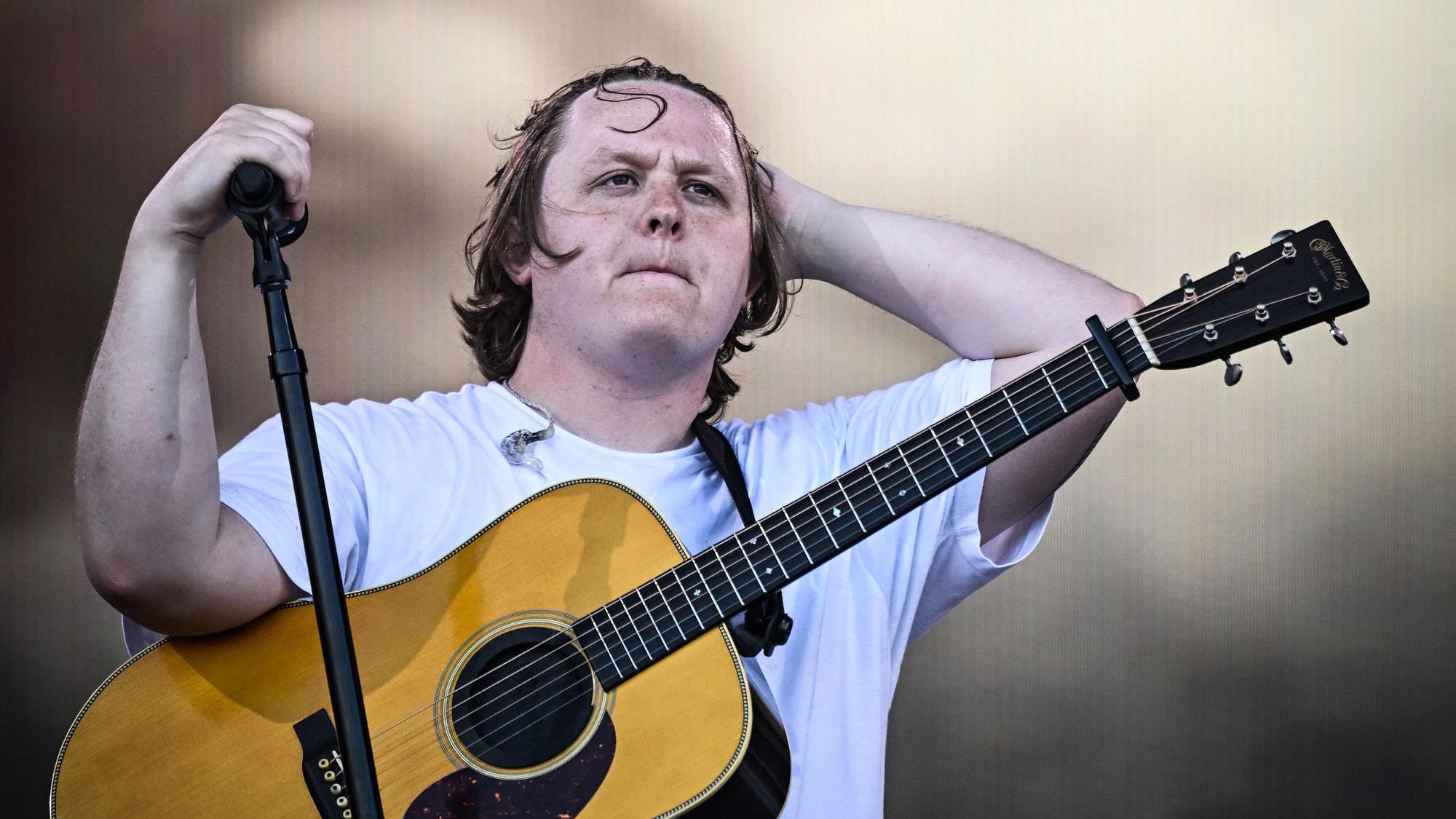 (FILES) Scottish singer Lewis Capaldi performs on The Pyramid Stage on day 4 of the Glastonbury festival in the village of Pilton in Somerset, southwest England, on June 24, 2023. Scottish singer-songwriter Lewis Capaldi on June 27 said he was taking a break from performing, after struggling to finish his set at the Glastonbury festival. The crowd at the event on Saturday stepped in to sing the lyrics to his final songs after Capaldi, 26, suffered vocal problems. (Photo by Oli SCARFF / AFP)