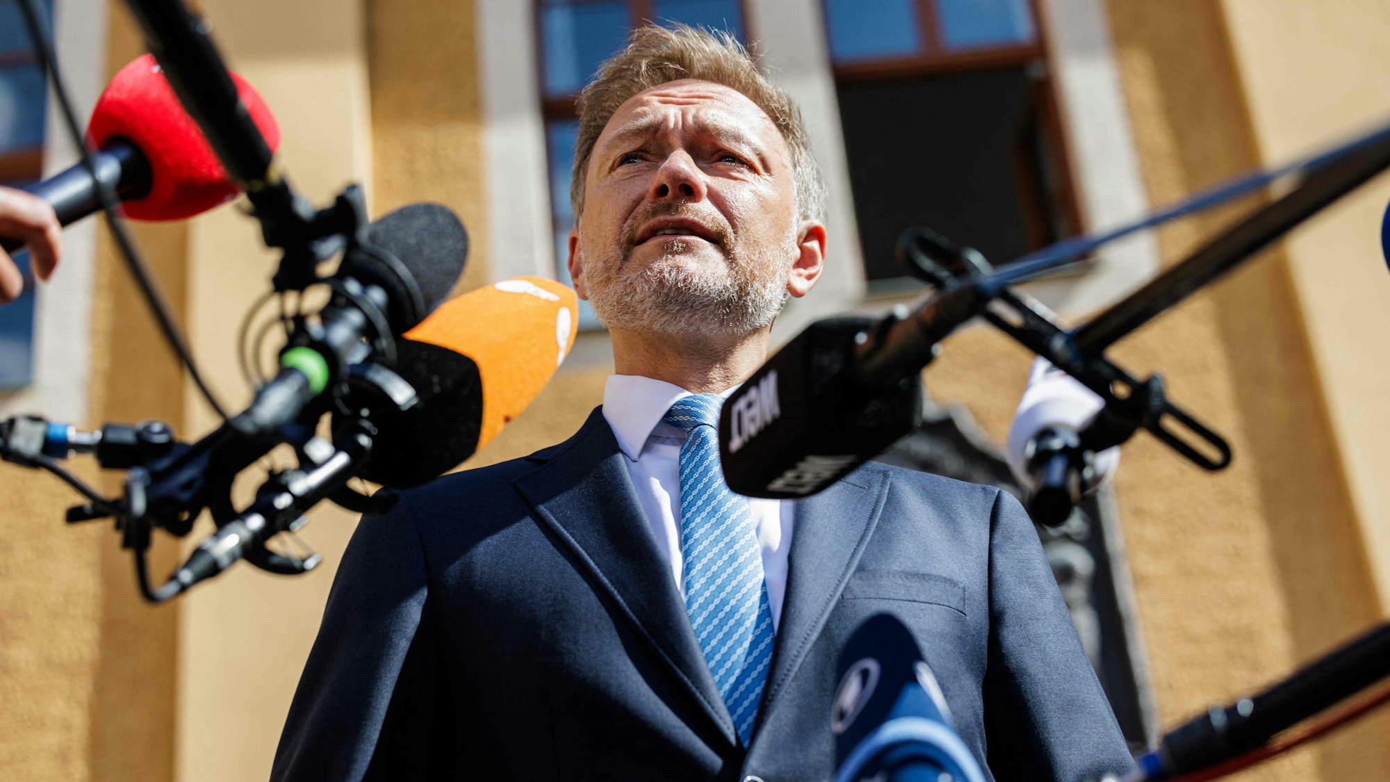 German Finance Minister Christian Lindner gives a press statement prior to a meeting of the "Weimar Triangle" format, an alliance between Poland, France and Germany, with his counterparts from Poland and France, in Ettersburg near Weimar, eastern Germany, on June 27, 2023. (Photo by JENS SCHLUETER / AFP)