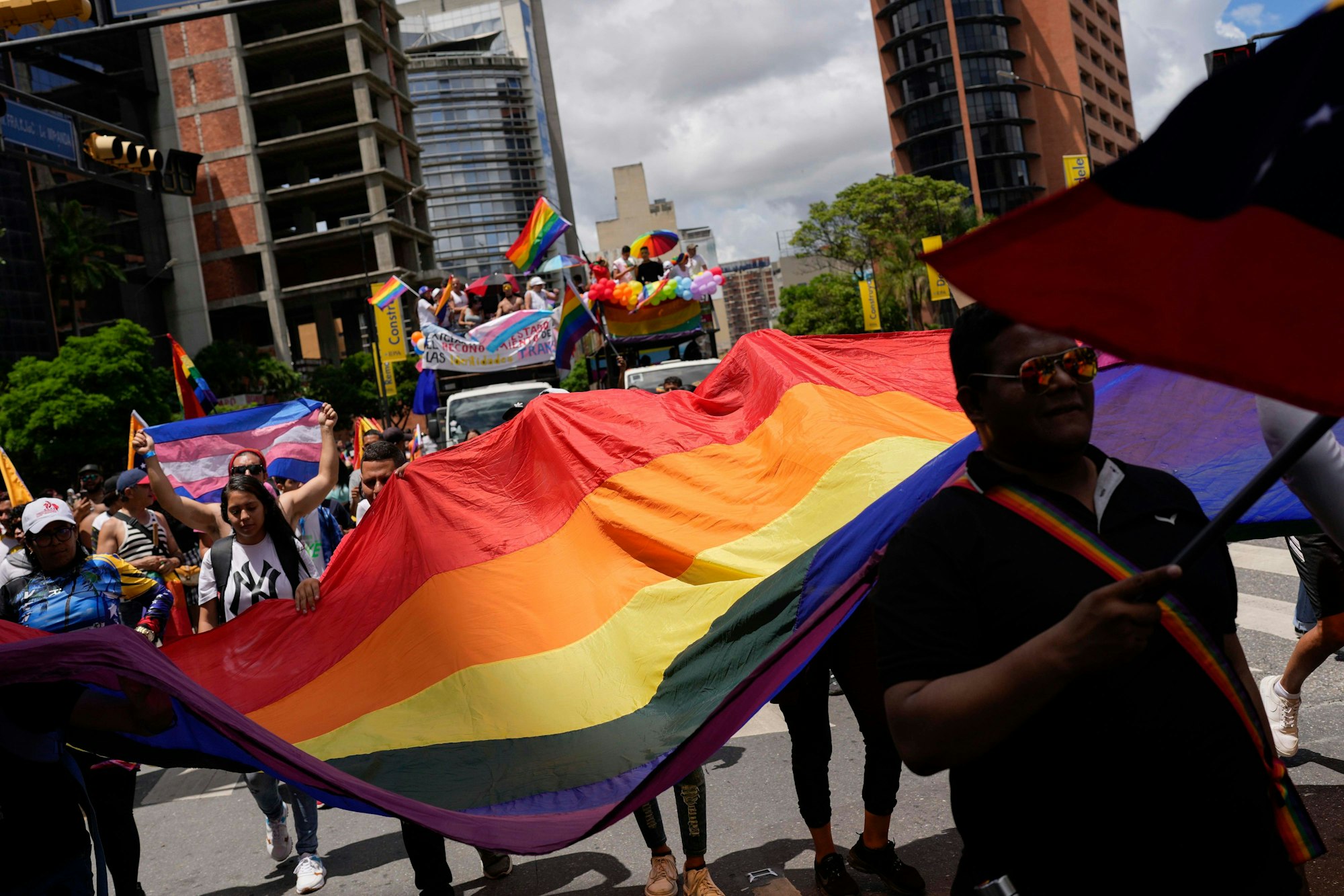 Revelers take part in the Gay Pride march in Caracas, Venezuela, Sunday, July 2, 2023. (AP Photo/Matias Delacroix)