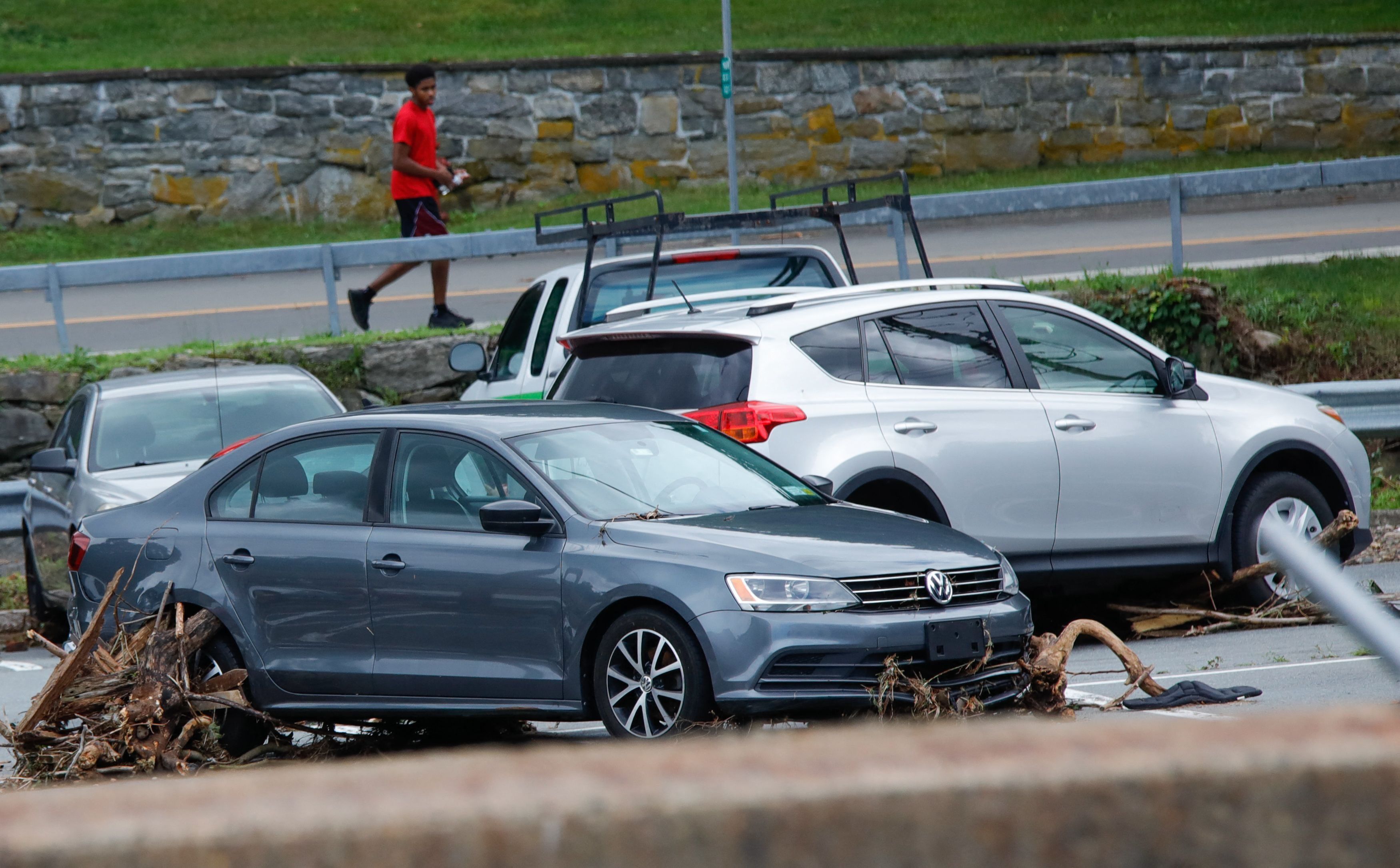 Debris carried by the flood are stuck against a car on Main Street after heay rains in Highland Falls, New York, July 10, 2023. The northeastern United States was inundated July 10, 2023, with heavy rain and flooding across several states a day after storms and flash floods washed out highways and killed one person in New York state. Heavy rains in New York state on July 9, 2023, turned streets into raging waterways, washing out bridges, leaving roads impassable and leading Governor Kathy Hochul to declare states of emergency in two counties.
