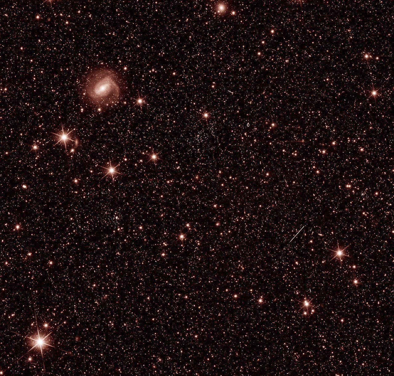 This handout photo provided courtesy of ESA/Euclid/Euclid Consortium/NASA on July 31, 2023, shows a test photo taken during commissioning of ESAs Euclid spacecraft, to check that the Near Infrared Spectrometer and Photometer (NISP) instrument is working as expected. The Euclid Space Telescope, whose mission is to study the dark matter of the Universe, reached its observation post and revealed its first test images on July 31, 2023. These images were taken to verify the operation of the scientific instruments and calibrate them, and are therefore not yet representative of the telescope's final capabilities. (Photo by ESA/Euclid/Euclid Consortium/NASA / AFP) / RESTRICTED TO EDITORIAL USE - MANDATORY CREDIT "AFP PHOTO/ESA/Euclid/Euclid Consortium/NASA" - NO MARKETING NO ADVERTISING CAMPAIGNS - DISTRIBUTED AS A SERVICE TO CLIENTS / To Go With AFP Story By Lucie AUBOURG: Euclid Space Telescope reveals its first test images
