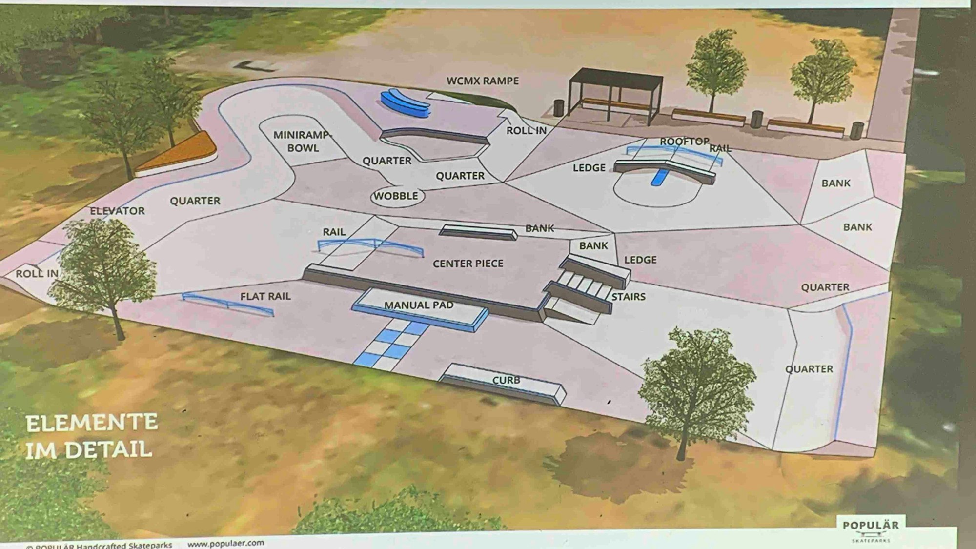Der neue Skatepark in Sankt Augustin ist von grünen Bäumen umrandet.