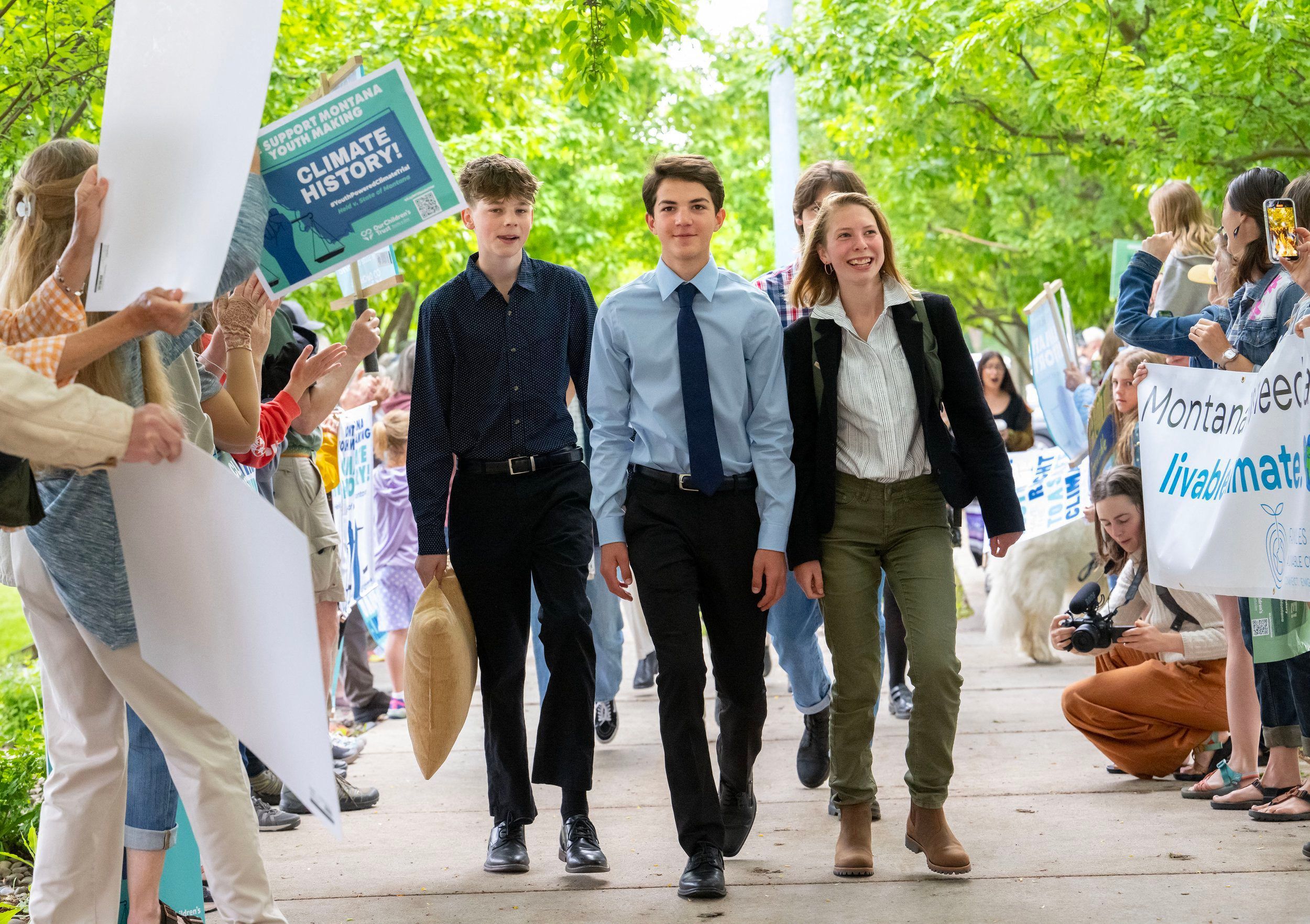 This picture provided by Our Children's Trust shows plaintiffs in the landmark Held vs Montana climate change lawsuit arrive to the Lewis and Clark County Courthouse on June 13, 2023 in Helena, Montana.