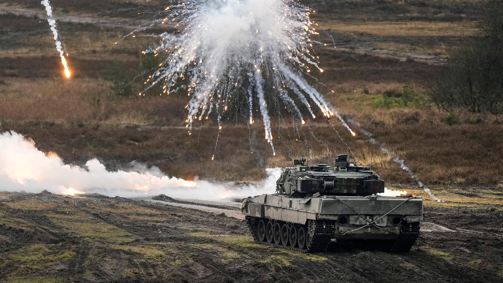 A Leopard 2 tank is seen in action during a visit of German Defense Minister Boris Pistorius at the Bundeswehr tank battalion 203 at the Field Marshal Rommel Barracks in Augustdorf, Germany, Wednesday, Feb. 1, 2023. After the government's decision to deliver fourteen Leopard 2 tanks to Ukraine, the capabilities of the Leopard 2A6 main battle tank are shown at a presentation in Augustdorf. (AP Photo/Martin Meissner)