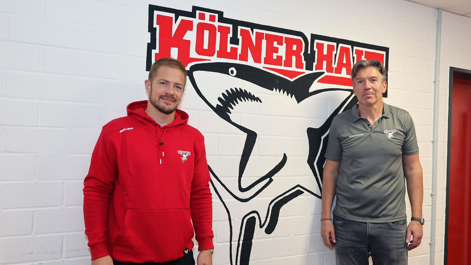 Haie-Kapitän Moritz Müller (l.) und Coach Uwe Krupp.