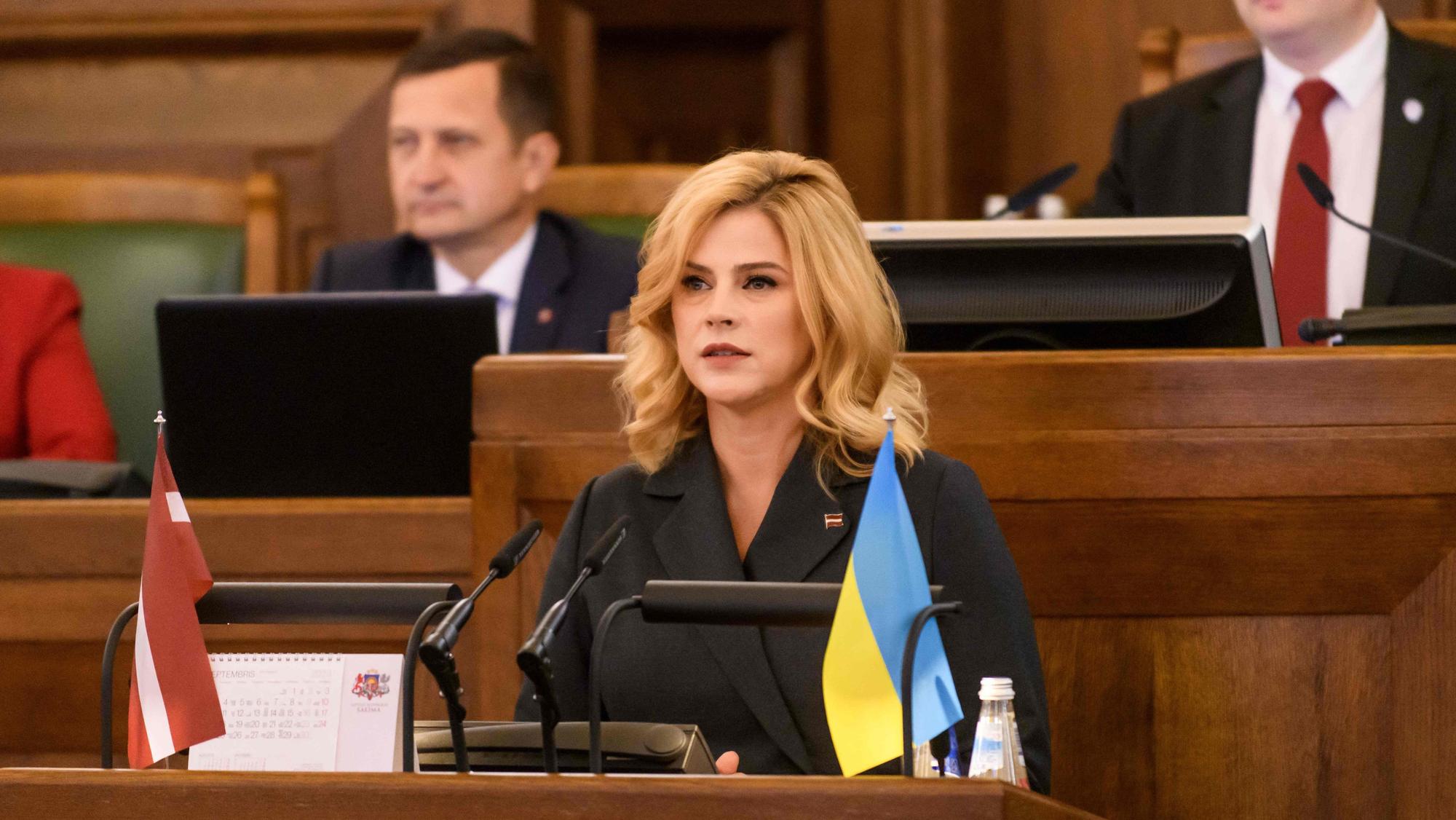 Candidate as new Prime Minister of Latvia Evika Silina of New Unity party (C) speaks at the Parliament of Latvia on September 15, 2023 in Riga, Latvia, prior to the debate and Parliament voting for confirmation of the new Cabinet of Ministers. (Photo by Gints Ivuskans / AFP)