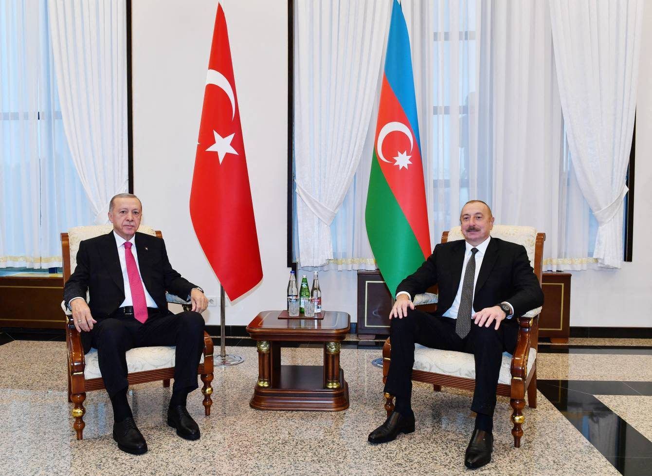 A handout image made available by Azerbaijani Presidency on September 25, 2023, shows Turkish President Recep Tayyip Erdogan (L) meets with Azerbaijan's President Ilham Aliyev, in the Nakhichevan enclave, a territory between Armenia and Iran on the border with Turkey. The visit was officially designed to launch the construction of a gas pipeline but the two presidents were also due to discuss Nagorno-Karabakh and the opening up to Azerbaijanis of Armenia's Zangezur corridor, Turkish media reported. (Photo by Handout / Azerbaijani presidency / AFP) / RESTRICTED TO EDITORIAL USE - MANDATORY CREDIT "AFP PHOTO / AZERBAIJANI PRESIDENCY/ handout" - NO MARKETING NO ADVERTISING CAMPAIGNS - DISTRIBUTED AS A SERVICE TO CLIENTS
