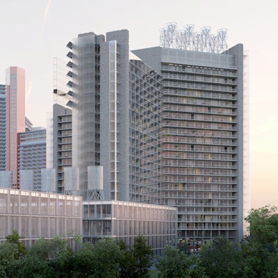 Ein Hochhaus und ein flaches Gebäude ist zu sehen.