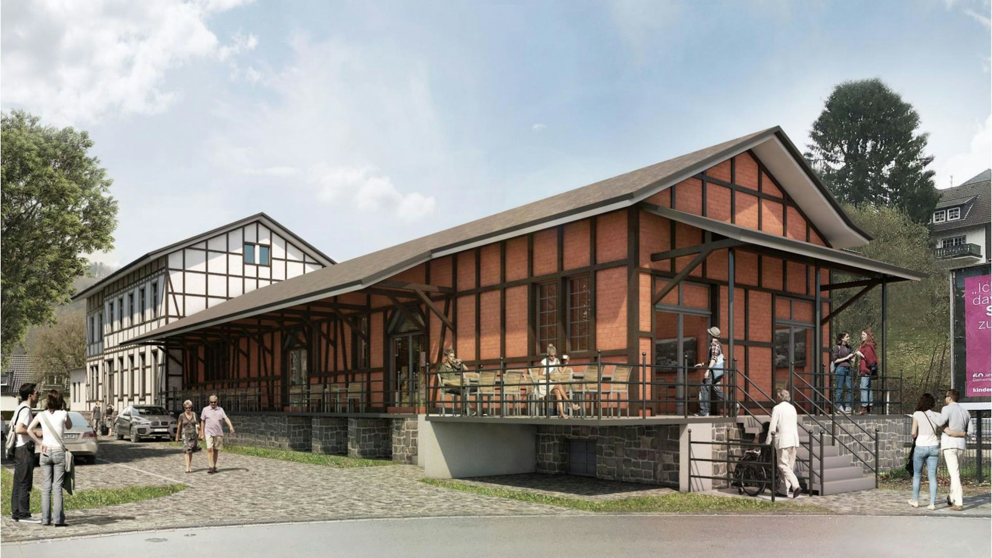 Eine Visulisierung zeigt den Bahnhof Ründeroth, wie er nach der Sanierung aussehen kann. Vor dem Gebäude sitzen Menschen auf der früheren Laderampe an Tischen und Stühlen, Passanten gehen vorbei.