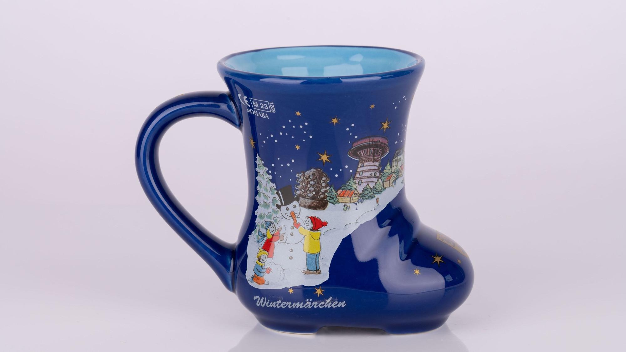 Auf dem Bild ist ein Becher mit Frechener Motiven zu sehen