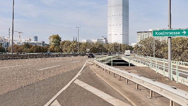 Diese Grafik zeigt, wie ein 120-Meter-Turm sich in den Blick Richtung Innenstadt von der Deutzer Zufahrt zur Zoobrücke stellt.