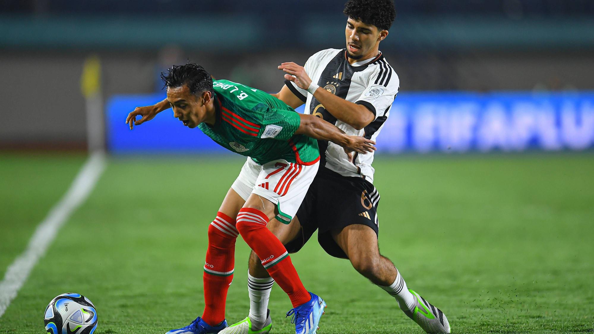 RECORD DATE NOT STATED FIFA U-17 World Cup Indonesia 2023 Mexico vs Germnay L-R, Brandon Lomeli of Mexico and. Fayssal Harchaoui of Germany during the game Mexico vs Germany, corresponding to Group F of the FIFA U-17 World Cup Indonesia 2023, at Si Jalak Harupat Stadium, on November 12, 2023. brbr I-D, Brandon Lomeli de Mexico y. Fayssal Harchaoui de Alemania durante el partido Mexico vs Alemania, correspondiente al Grupo F de la Copa Mundial de la FIFA Sub-17 Indonesia 2023, en el Estadio Si Jalak Harupat Stadium, el 12 de Noviembre de 2023. BANDUNG INDONESIA INDONESIA PUBLICATIONxNOTxINxMEXxCHNxRUS Copyright: xAdrianxMaciasx 20231112060647_FWC_U17_GF_MEX_GER_LOMELI21