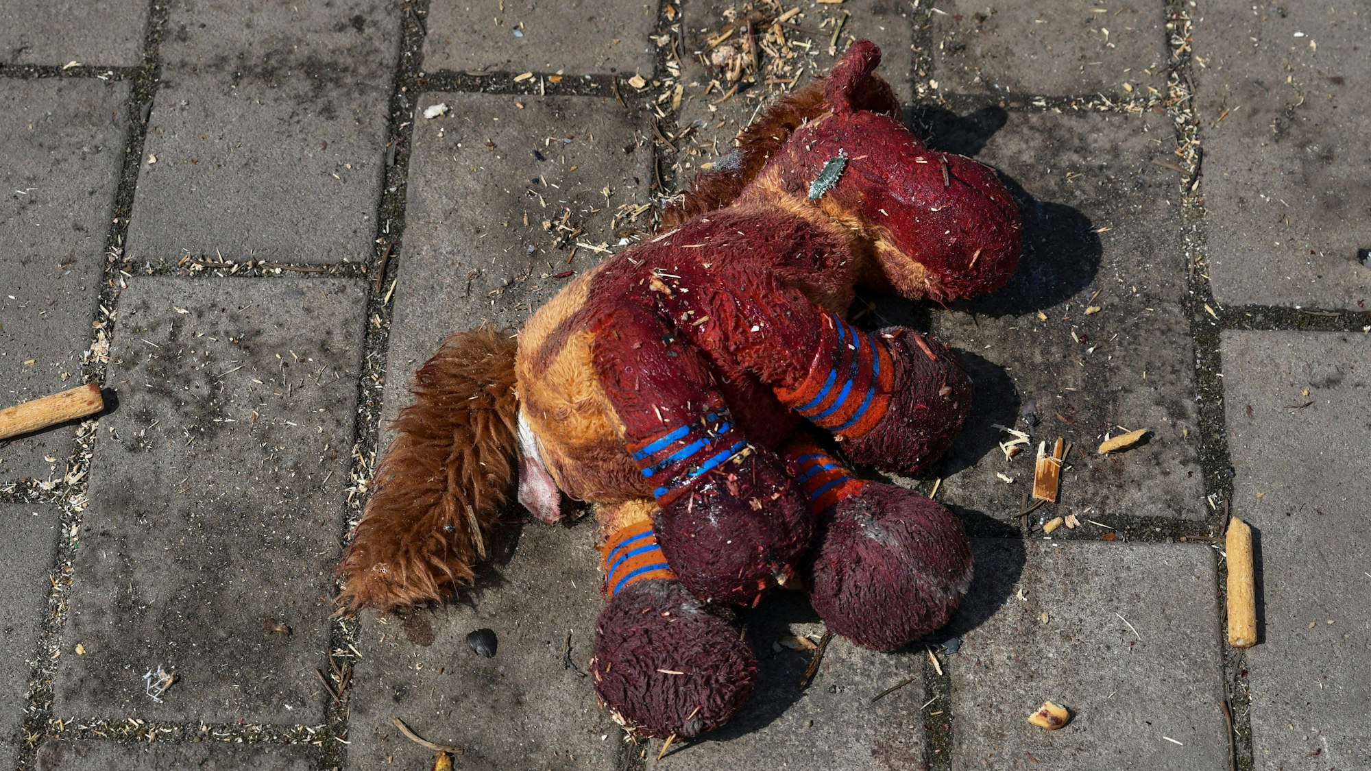A stuffed horse with bloodstains on it lies on a platform after Russian shelling at the railway station in Kramatorsk, Ukraine, Friday, April 8, 2022. Hours after warning that Ukraine's forces already had found worse scenes of brutality in a settlement north of Kyiv, President Volodymyr Zelenskyy said that “thousands” of people were at the station in Kramatorsk, a city in the eastern Donetsk region, when it was hit by a missile. (AP Photo/Andriy Andriyenko)