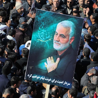 (FILES) Iranian mourners gather during the final stage of funeral processions for slain top general Qasem Soleimani, in his hometown Kerman on January 7, 2020. At least 20 people were killed in Iran on January 3, 2024 as two blasts struck a crowd marking the anniversary of the 2020 killing of general Qasem Soleimani, state television reported. Soleimani was killed outside Baghdad airport on January 3, 2020 in a drone strike ordered by then-US President Donald Trump. (Photo by ATTA KENARE / AFP)