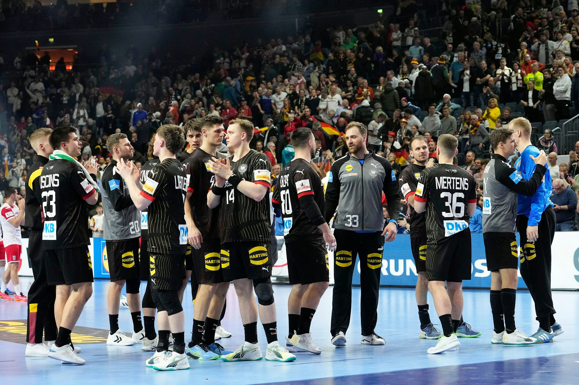 Team Germany stands disappointed on the field after losing the Handball European Championship main round match between Germany and Croatia in Cologne, Germany, Wednesday, Jan. 24, 2024. (AP Photo/Martin Meissner)