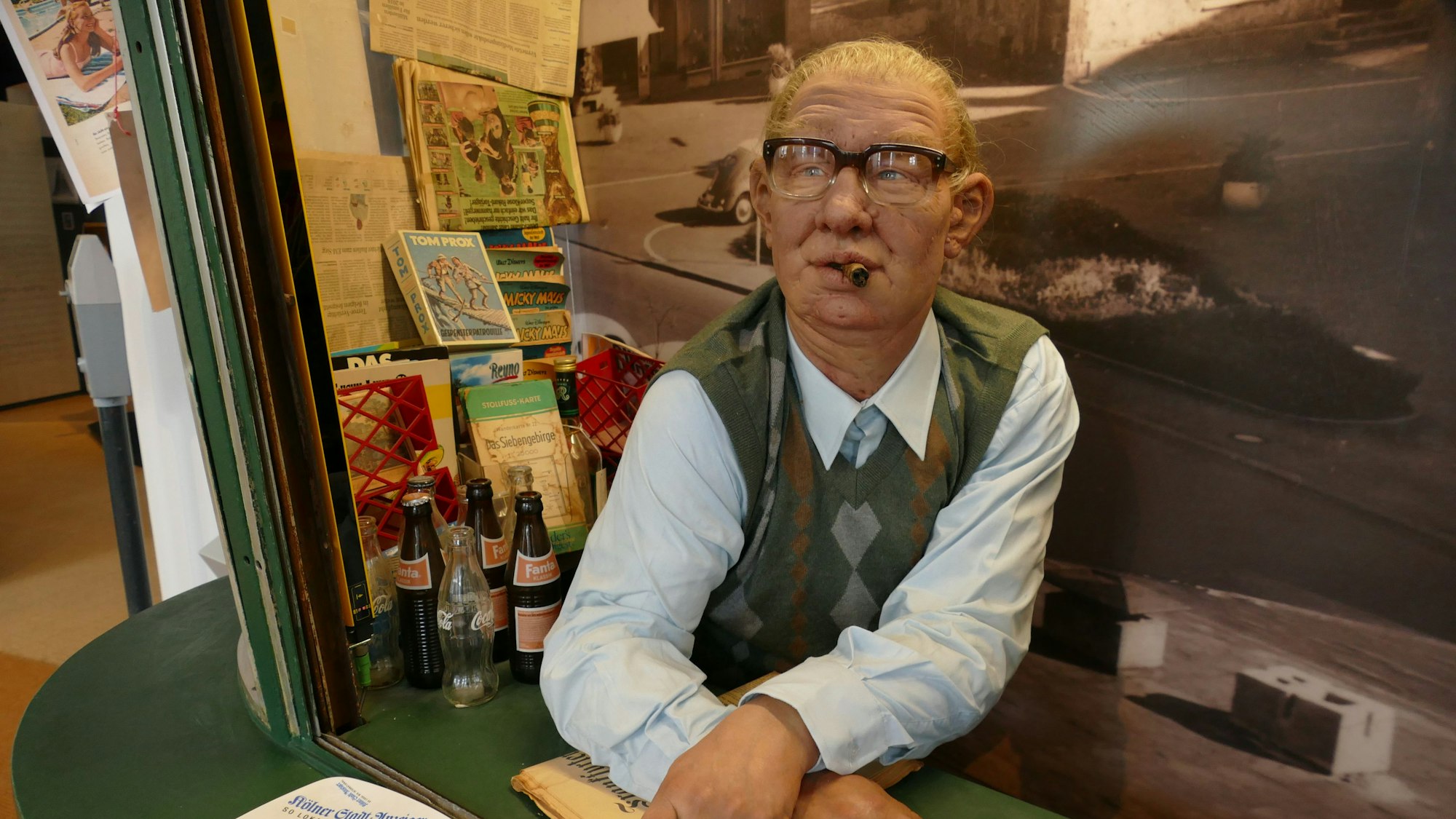 Figur eines Kioskbesitzers.