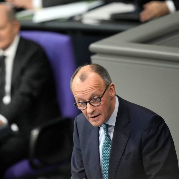 Opposition Christian Union parties floor leader Friedrich Merz, right, speaks, as German Chancellor Olaf Scholz, listens during a general debate on the budget at the German parliament Bundestag in Berlin, Germany, Wednesday, Jan. 31, 2024. (AP Photo/Ebrahim Noroozi)