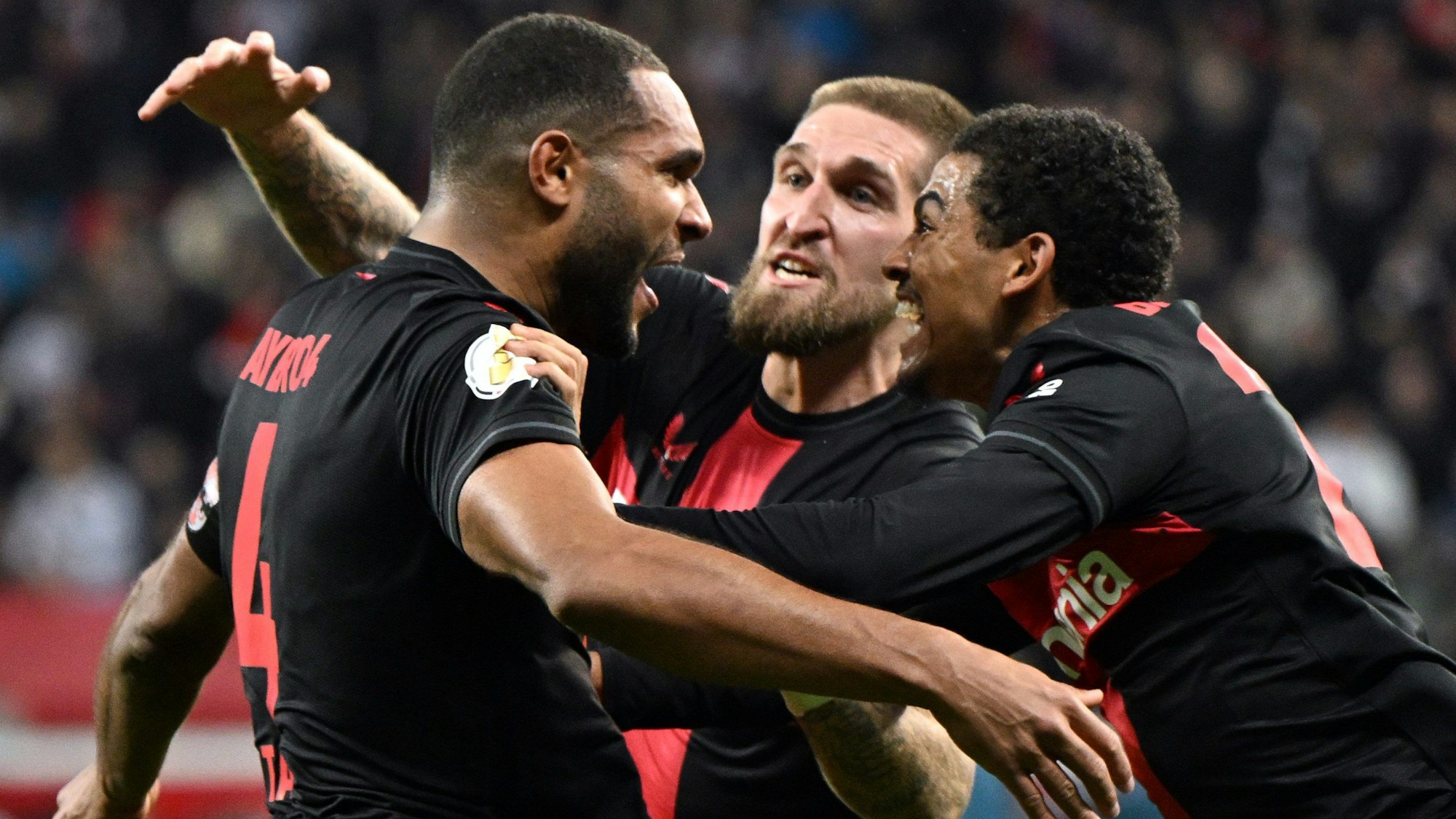 DFB-Pokal, Bayer Leverkusen - VfB Stuttgart, Viertelfinale, BayArena Jonathan Tah (l-r), Robert Andrich und Amine Adli bejubeln das Tor zum 3:2.