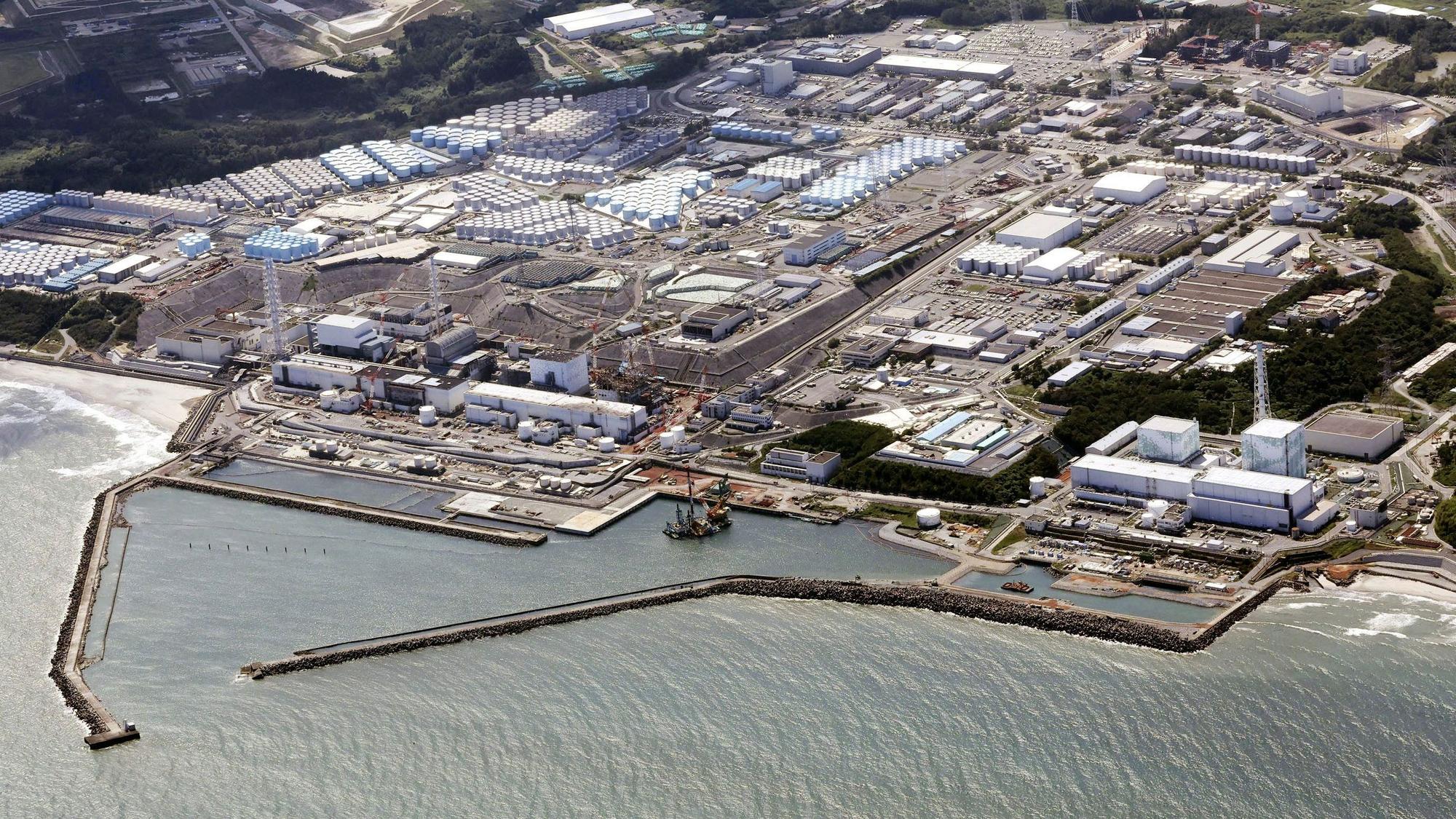 FILE - This aerial view shows the Fukushima Daiichi nuclear power plant in Fukushima, northern Japan, on Aug. 24, 2023, shortly after its operator Tokyo Electric Power Company Holdings TEPCO began releasing its first batch of treated radioactive water into the Pacific Ocean. Japan's wrecked Fukushima nuclear power plant said it began releasing a second batch of treated radioactive wastewater into the sea on Thursday, Oct 5, 2023, after the first round of discharges ended smoothly.(Kyodo News via AP, File)