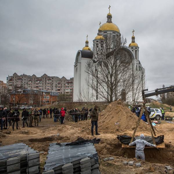 Forensic technicians exhume the bodies of civilians who Ukrainian officials say were killed during Russia’s invasion and then buried in a mass grave in the town of Bucha, outside Kyiv, Ukraine April 13, 2022. REUTERS/Volodymyr Petrov