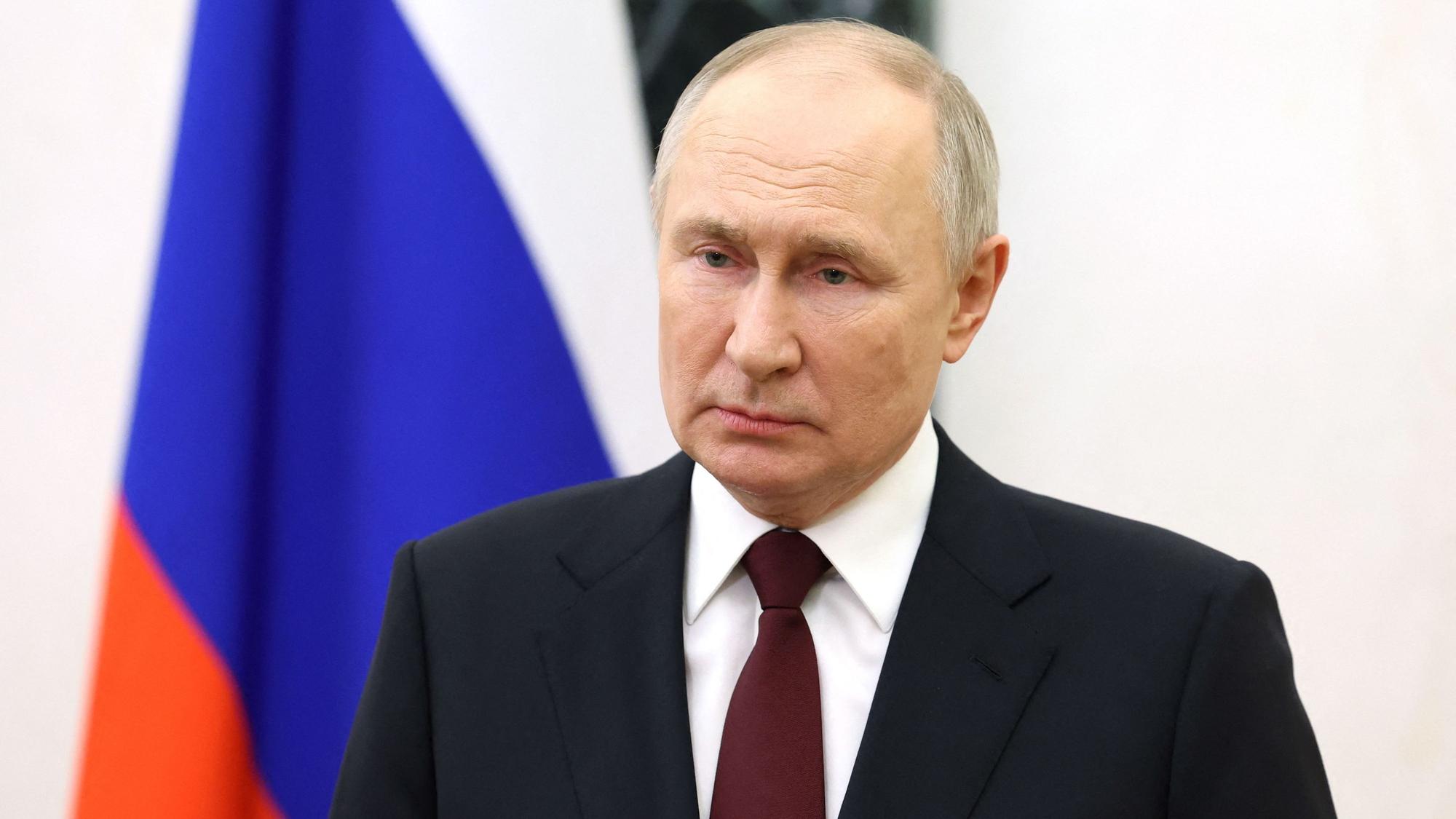 In this pool photograph distributed by Russian state agency Sputnik on February 27, 2024, Russia's President Vladimir Putin makes a video address to congratulate the military personnel and veterans of the Special Operations Forces, a branch of the Armed Forces of Russia, on their professional holiday at the Kremlin in Moscow. (Photo by Alexander KAZAKOV / POOL / AFP)