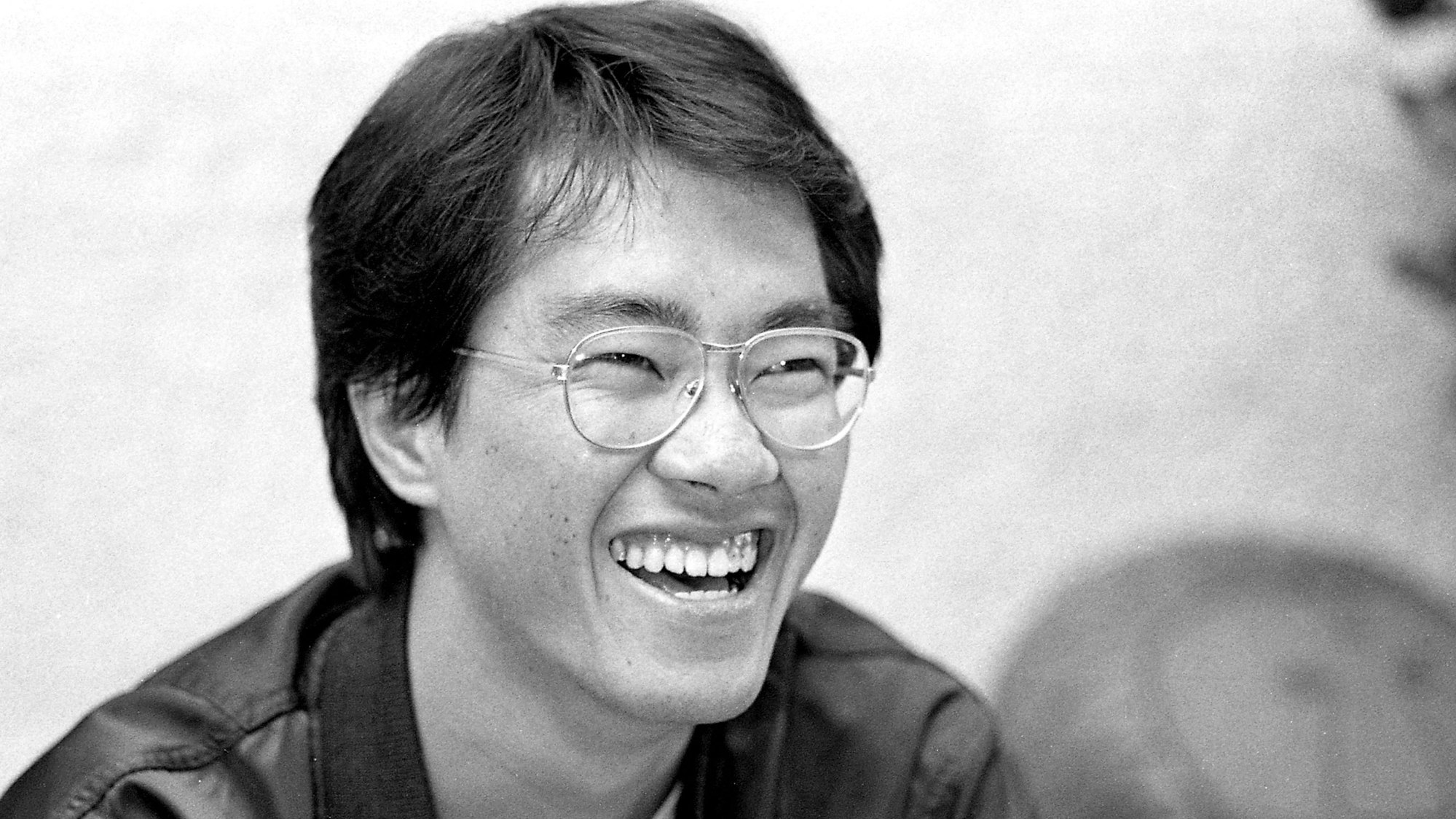 This black and white photo taken in May 1982 shows Japanese manga artist Akira Toriyama, whose death was announced on March 8, 2024. The creator of Japan's hugely popular and influential "Dragon Ball" comics and anime cartoons, Akira Toriyama, has died aged 68, his production team said on March 8, 2024. (Photo by JIJI Press / AFP) / Japan OUT