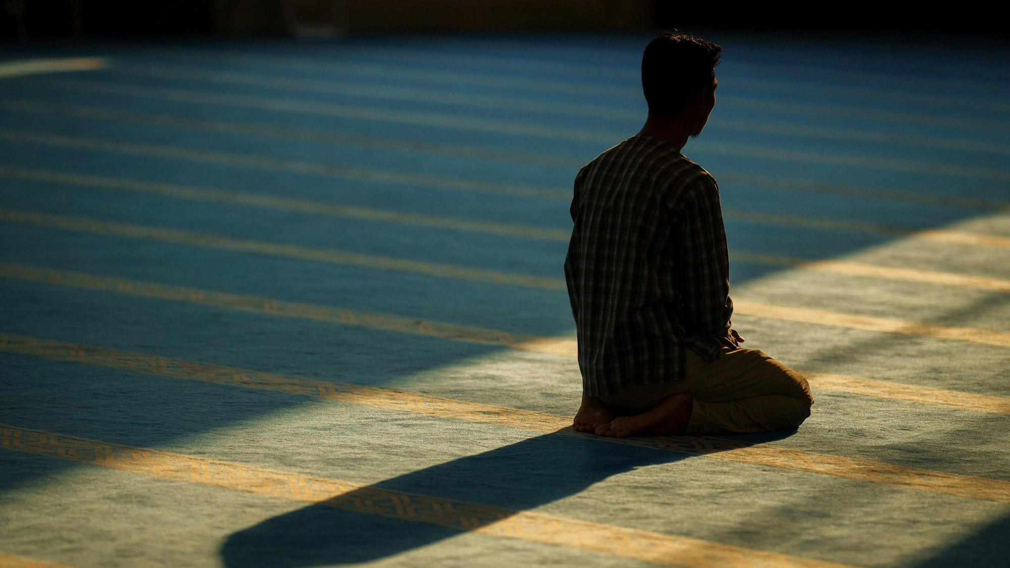 A man prays during the holy month of Ramadan at Sri Sendayan mosque in Negeri Sembilan state