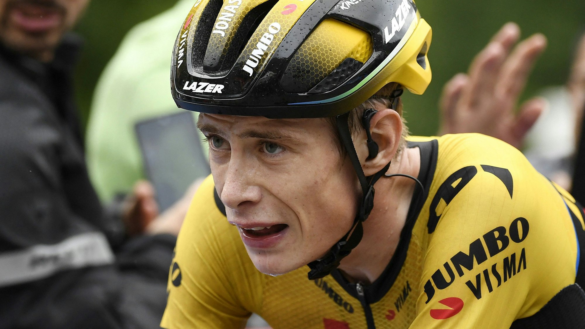 (FILES) Team Jumbo-Visma's Danish rider Jonas Vingegaard rides after crossing the finish line in first place during the stage 16 of the 2023 La Vuelta cycling tour of Spain, a 120 km race between Liencres and Bejes on September 12, 2023. Two-time Tour de France champion Jonas Vingegaard was "conscious" after being taken to hospital following a mass crash in stage four of the Tour of the Basque Country race, his team said on April 4, 2024. (Photo by MIGUEL RIOPA / AFP)
