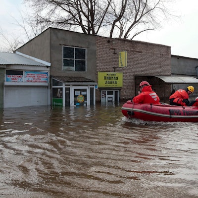 Russian Emergency Ministry employees ride a boat as they patrol the flooded street in Orenburg, Russia, Friday, April 12, 2024. Floods have sparked evacuations of thousands in the Orenburg region, located some 1,200 kilometers (745 miles), southeast of the capital of Moscow after a dam on the river burst last week under the pressure of surging waters. Local authorities have declared a state of emergency in the region. (AP Photo)