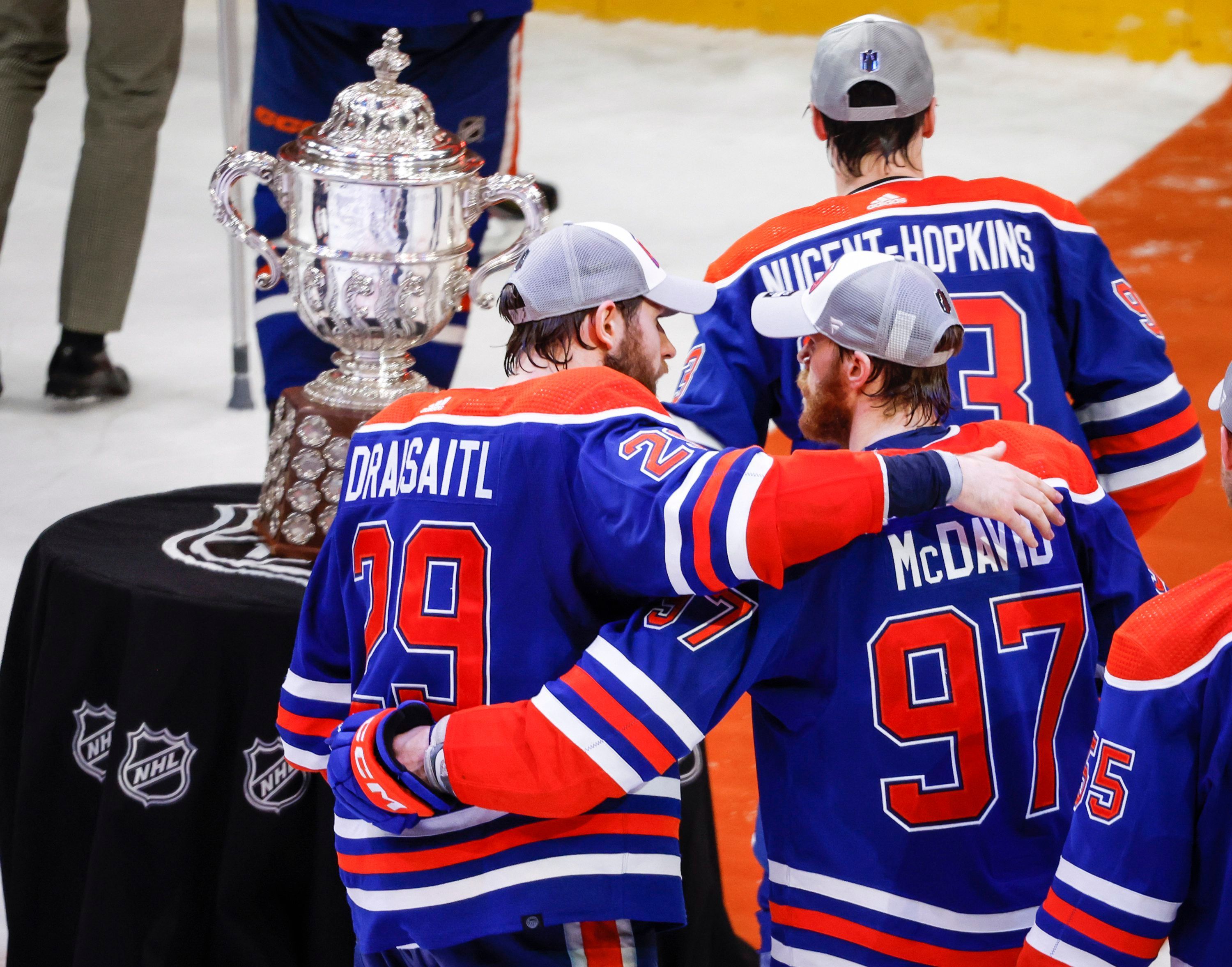 Edmonton Oilers forward Connor McDavid (97) and forward Leon Draisaitl (29) embrace after defeating the Dallas Stars in Game 6 of the Western Conference finals of the NHL hockey Stanley Cup playoffs in Edmonton, Alberta, Sunday, June 2, 2024. (Jeff McIntosh/The Canadian Press via AP)