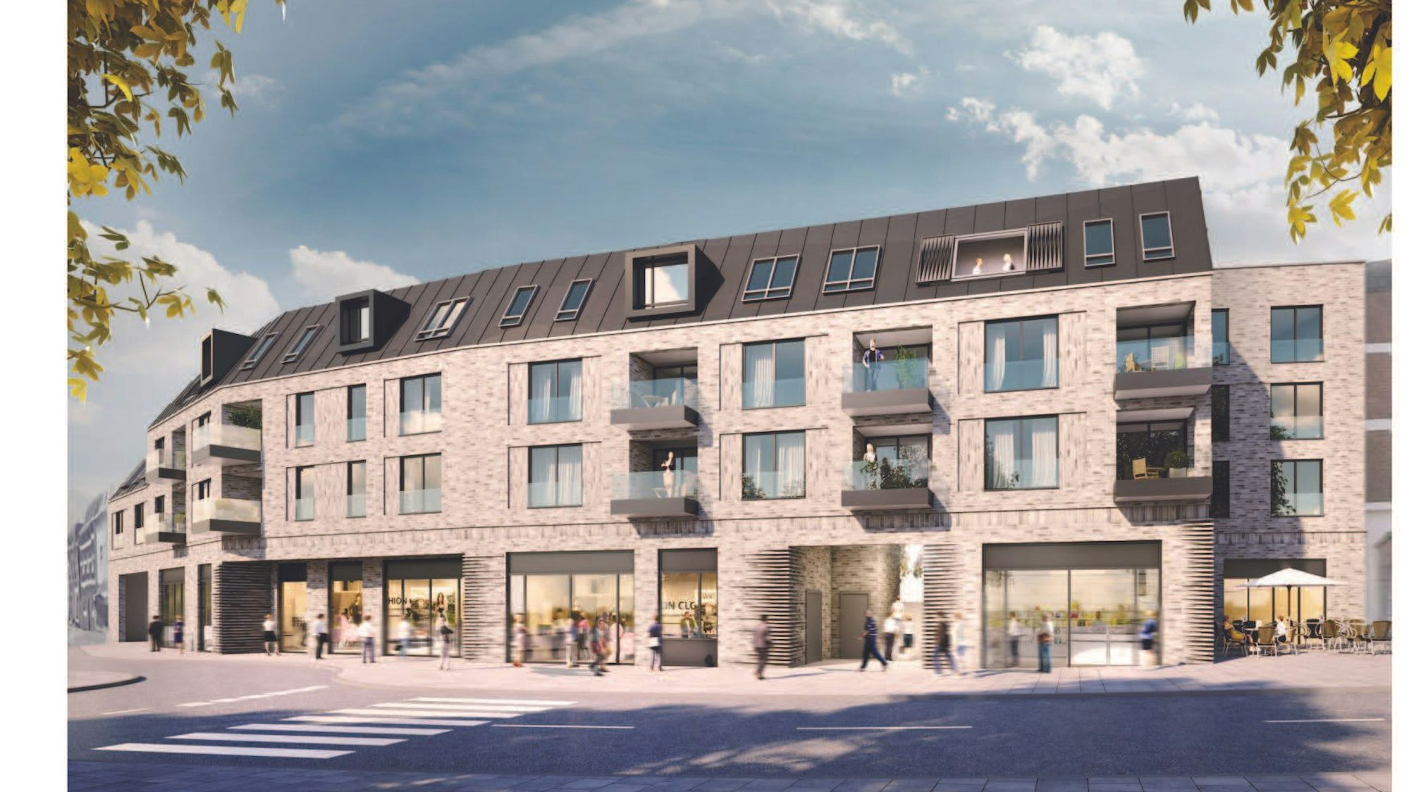 Ein Gebäude mit einer verklinkerten Fassade, im Erdgeschoss Ladenlokale.