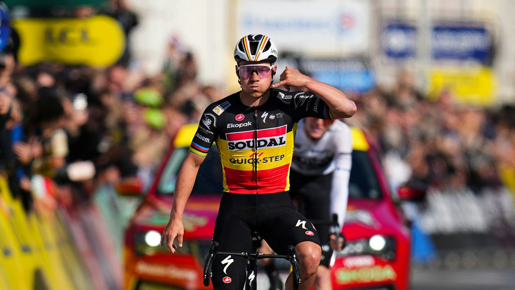 FILE - Belgium's Remco Evenepoel celebrates as he crosses the finish line to win the eighth and final stage of the Paris-Nice cycling race in Nice, on March 10, 2024. Tour de France favorites Remco Evenepoel and Primoz Roglic were caught up in a massive crash Thursday June 6, 2024 at the Criterium du Dauphine race that led organizers to neutralize the stage. (AP Photo/Daniel Cole, File)