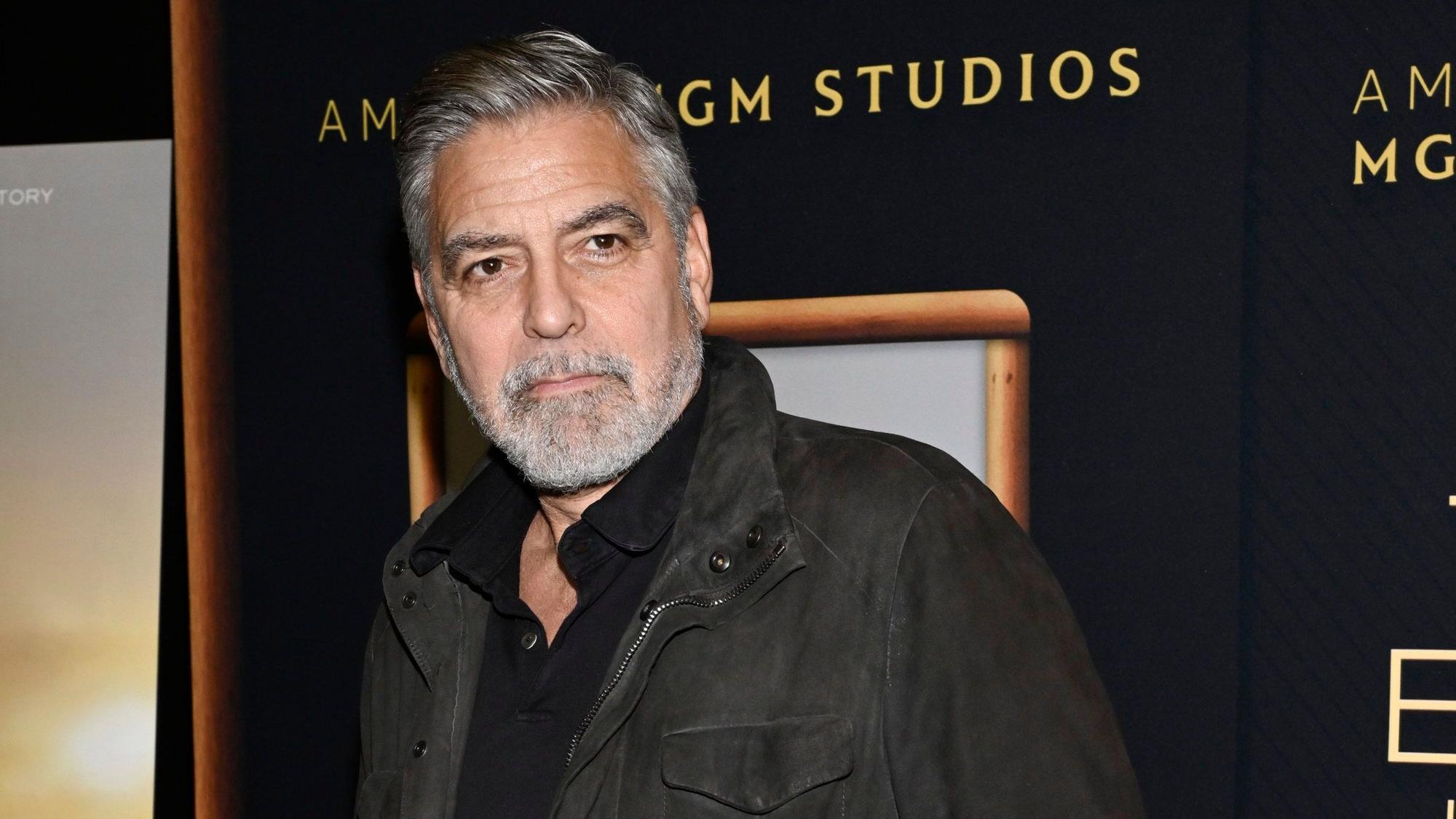 FILE - Director George Clooney attends a special screening of "The Boys in the Boat," Dec. 13, 2023, in New York. Movie star and lifelong Democrat George Clooney is adding his voice to calls for Joe Biden to leave the presidential race. Clooney says in a New York Times opinion piece Wednesday that he loves Biden, but the party would lose the presidential race as well as any control in Congress with him as the nominee. (Photo by Evan Agostini/Invision/AP, File)