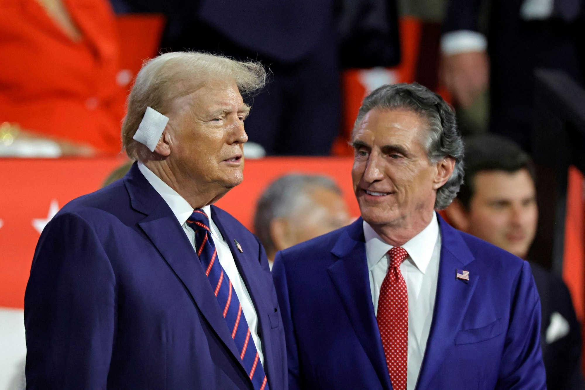 US former President and 2024 Republican presidential candidate Donald Trump (L) chats with North Dakota Governor Doug Burgum during the third day of the 2024 Republican National Convention at the Fiserv Forum in Milwaukee, Wisconsin, on July 17, 2024. Days after he survived an assassination attempt Donald Trump won formal nomination as the Republican presidential candidate and picked Ohio US Senator J.D. Vance for running mate. (Photo by Kamil Krzaczynski / AFP)