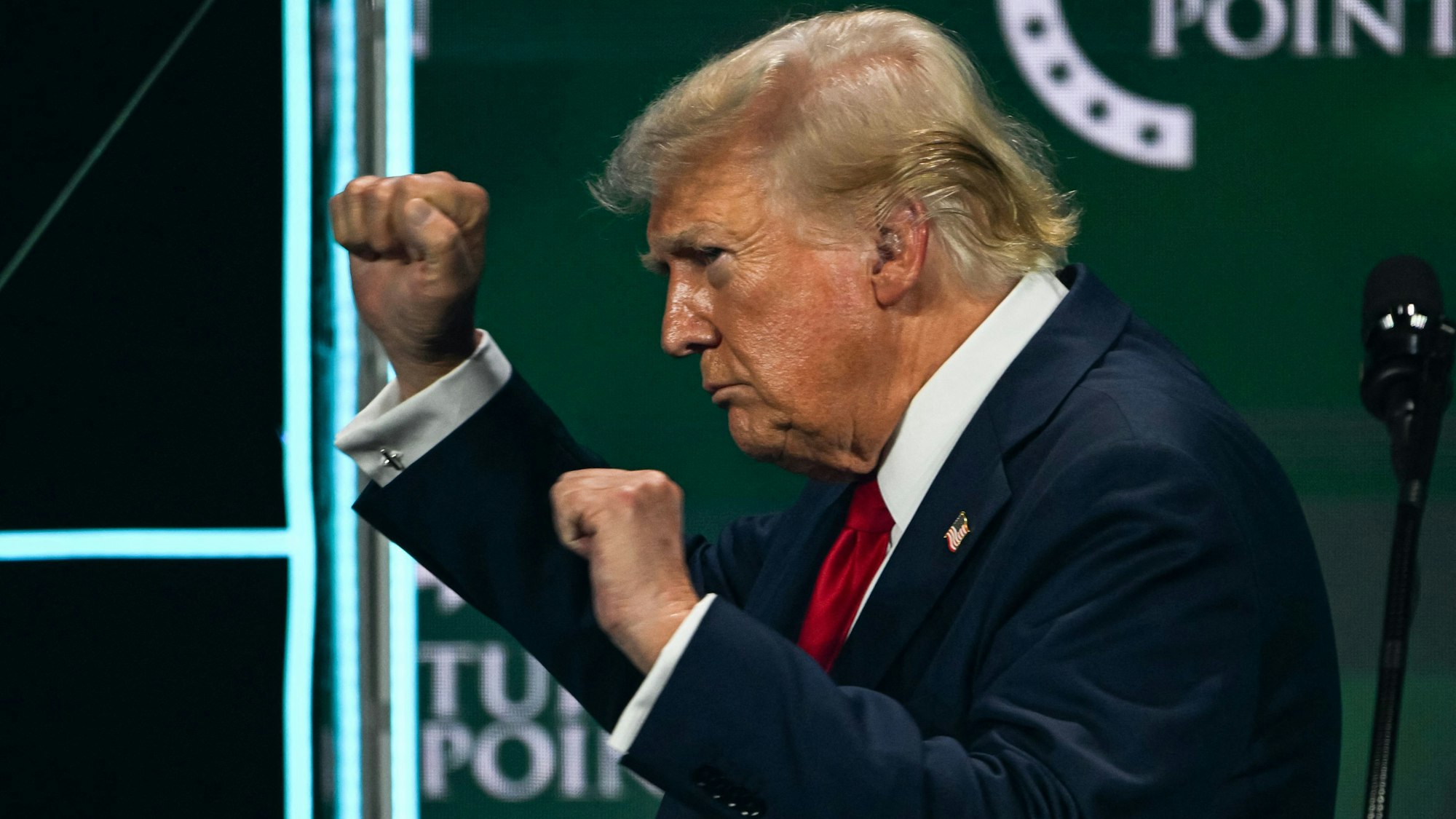 Former US President and 2024 Republican presidential candidate Donald Trump gestures after speaking at Turning Point Action's "The Believers Summit" in West Palm Beach, Florida, on July 26, 2024. (Photo by CHANDAN KHANNA / AFP)